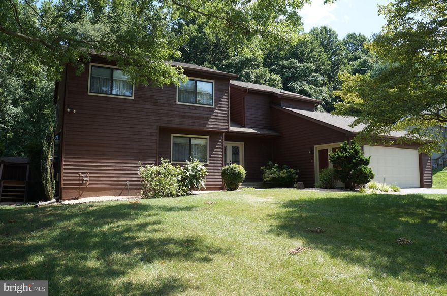 Fantastic contemporary style and former model home on prime lot location backing up to woods.  Home features, dual zone climate control with separate units for each zone, 4 bedrooms, 3.5 baths, new paint, hardwood floors, finished basement, remodeled kitchen, huge master bedroom with master bath featuring, granite bathroom with jacuzzi tub and separate shower area. Private deck area with views to trees in back yard and the occasional deer.   Don't miss this lovely one of a kind home! Perfectly located for the commute to work, shopping, entertainment and so much more!