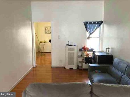 Welcome to 3438 N 6th St, located in the North Central neighborhood of Philadelphia. This 2-story home offers 3 bedrooms and 1 full bathroom, making it a fantastic opportunity for investors or anyone looking to expand their portfolio. The first floor features an open floor plan with hardwood flooring throughout, creating a cohesive and inviting space. The kitchen, outfitted with ceramic tile flooring, leads directly to a large backyard, providing room for outdoor enjoyment or potential enhancements. Head upstairs to find three bright bedrooms and the full bathroom, all with hardwood flooring that continues the clean and low-maintenance design. The property also includes a basement, adding additional storage or project potential. Currently rented for $1,200/month, with tenants month to month and generating $14,400 in annual income, this property is an excellent investment opportunity. Don’t miss the chance to add this income-producing property to your portfolio!