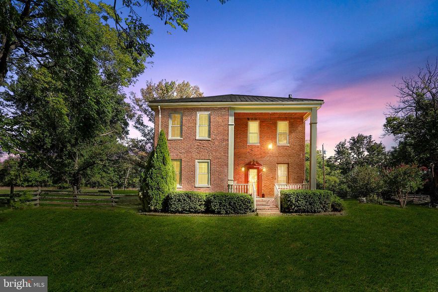 This 1900s home is full of history!  Once a civil war hospital, this beautifully rustic home features original hardwood floors,  3-4 bedrooms, 2 bathrooms, a wood burning stove, gas fireplace, dining room, living room, family room, main level washer and dryer, office and upgraded kitchen. Enjoy a relaxing bubble bath in the antique claw tub. The serene landscape encompasses wildlife and sunset views over the back acreage. Sip your morning coffee on the expansive custom stamped patio or one of the 2 porches. Additional Large 2 story barn with attached workshop provide plenty of storage, space to work. Make this farmhouse your homestead!