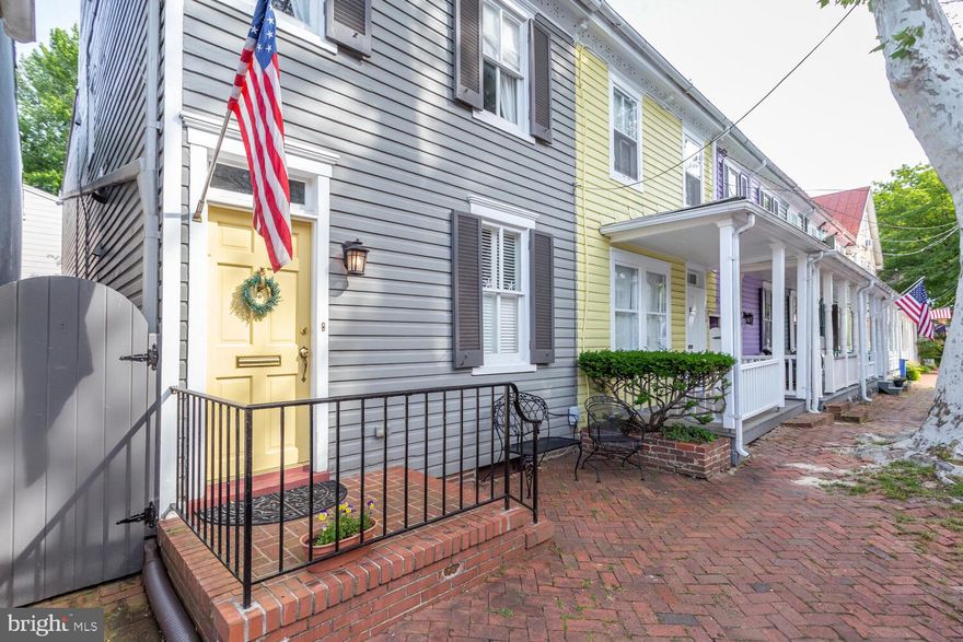 Charming and one-of-a kind townhome on coveted Market Street, a few blocks from Historic Downtown and Spa Creek, the Dock, Ego Alley, more restaurants offering fine, casual, fun and good dining with all that downtown Annapolis has to offer. Meticulously kept, MOVE-IN READY and in pristine condition, this 3-STORY, sparkling clean home offers crown molding, open floor plan, recessed lighting, some original and restored gleaming oak floors, remodeled kitchen, stainless steel, all NEW kitchen appliances, granite, private backyard, brick patio and NEW privacy fence, three (3) LARGE bedrooms, 2.5 FULL baths, a  STUDY/EXTRA BED,  first floor powder room, ceiling fans, Central Air, Gas Heat, fresh and airy, neutral paint, remodeled baths, NEW furnace, NEW hot water heater,  double walk-in closets in the Primary Bedroom, second floor Washer and Dryer, a metal roof recently coated, and has all the modern amenities in a beautifully kept and designed townhome on one of the most desirable streets in Historic Downtown.  Market is a one-way street and this home won't last long.  If you've been searching for that perfect spot downtown, here it is.  Come see it!