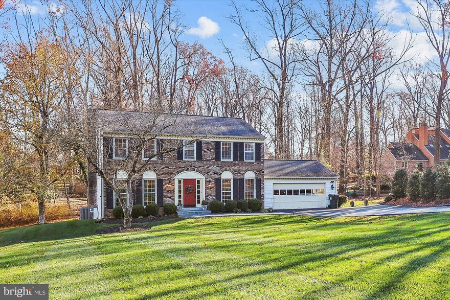 Open House 2/15 from 1-3pm. Price improvement! Come tour this well maintained home in the heart of Great Falls! Open House Open Classic Great Falls Center Hall Colonial on private 1/2 acre lot in Hickory Creek community. Great neighborhood close to Great Falls Center and easy access to Rt 7.  This home has been loved and meticulously maintained by owners who fell in love with it and raised their family there.  It is tucked back from the road and nicely landscaped with newer driveway, stone walkway and  stepping stoves through arbor to rear yard and deck.  Beautiful hardwood floors throughout upper level and main level.  Kitchen with lots of light and opens up to large room off the kitchen. Main level office could also be a dining room or playroom. Laundry on main level, off garage.  Nice sized 2-car garage for larger vehicles.  4 bedrooms upstairs all with hardwood floors. Primary bedroom has sitting room, double closets and updated bath.  Walkout basement with legal bedroom and several rooms for workout, office, recreation room and a rough in plumbing for a bathroom.