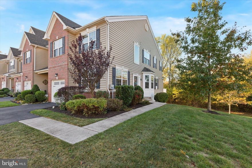 Fantastic opportunity to rent this luxury end-unit townhome features 3 bedrooms, 2.5 baths, 1 car garage and a fully finished walk-out basement. This fully upgraded 8 year young home is situated in the community of 'Mainland Square' in Harleysville, located in one of the best lots w/wooded backyard for privacy and in the award winning North Penn School District.  This house was originally designed for 4 bedrooms, however, one of the bedrooms converted to a sitting/office next to the primary bedroom.  Some of the upgraded features include recessed lighting, wainscoting, beautiful hardwood flooring throughout the main level and turned staircase.  Additionally, LVP flooring in the basement, upstairs hallway and all bedrooms. As you enter the foyer, office/study with French door entrance on the left and a dining area on your right that seamlessly open to an eat-in kitchen with island that features granite countertops, ceramic tile backsplash, abundant cabinets, built-in microwave and stainless steel appliances. Great room has a gas fireplace and leads out to the large rear composite deck, perfect spot for your morning coffee while overlooking the wooded backyard or BBQ parties with your family and friends during the summer season. The second floor boasts the primary  bedroom with Dutch Colonial ceiling, French door entrance to your personal office/sitting room, a large walk-in closet and full bath with double bowl vanity and large stall shower. There are also 2 additional bedrooms, one with ceiling fans and both rooms have a nice size closet, a full hall bath and a convenient laundry room to round out the second floor. The full finished basement offers maintenance free LVP flooring, loaded recessed lights, walkout and a large entertaining space. The community offers a walking trail as well as plenty of overflow parking. Last but not least is the location!! 'Mainland Square' is just minutes from the Lansdale interchange of the Pa-Turnpike which makes any commute a breeze. This is a must see home!!