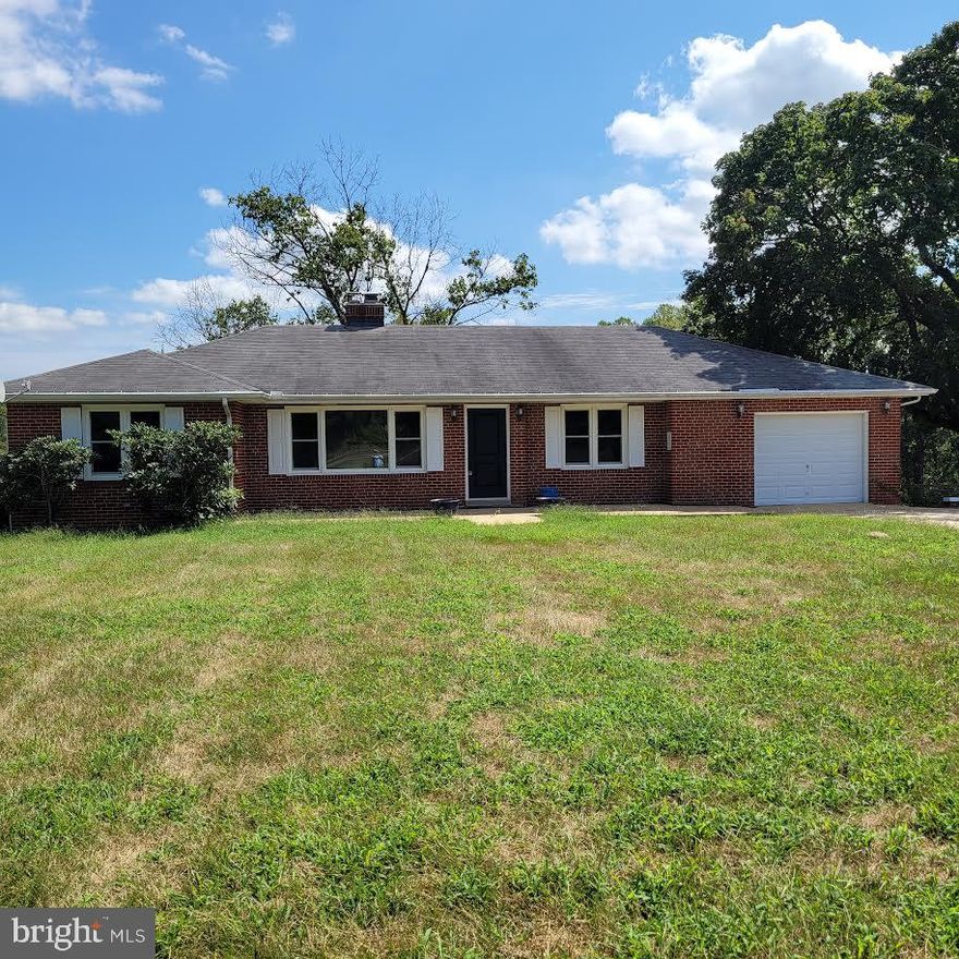 THIS IS COUNTRY LIVING AT ITS BEST!!  Relax on the front porch of this all brick rambler on one acre, and enjoy the rural atmosphere of  horses & farmland! STATE PARK, FISHING AND CANOEING just down the road, yet  20 minutes to Andrews AFB...10 minutes to Rte 301, a gas station, pharmacy & grocery store! This home is move in ready and upgraded with new  paint, refinished floors, a new heat pump system, windows, renovated bathrooms and kitchen w/ a new refrigerator.  Don't have to mow the grass... Lawn maintenance is INCLUDED in the rent!  Home has 3 bedrooms, large livingroom with a woodburning fireplace,  country kitchen and bathroom on the main level; and the wide open basement can be used in a variety of ways along with a full bathroom, separate utility room and a bar for entertaining.  The one car garage also has outside parking for 3 cars.  TAKE A TOUR>>> Make your appointment today!