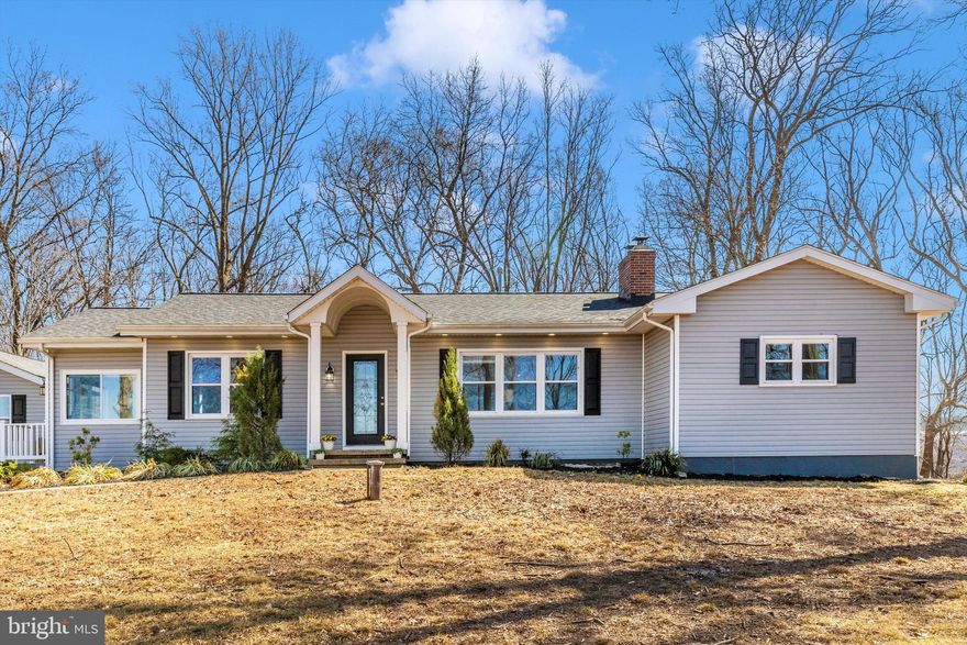 Done to the 9s with so many extras to love! Feel right at home from the first step in! Front living room welcomes you with a detailed coffered ceiling, hardwood floors and built-ins framing the new (2020) cozy and efficient wood stove fireplace.
High end kitchen with fresh white kitchen cabinetry, coordinating classy backsplash, granite countertops and stainless appliances. Clean lines flow into the formal dining room which boasts crown molding and custom ceiling.
3 bedrooms, 2 bathrooms and a sizable laundry/ mud room round out the main level. Primary ensuite has dual closets, ample natural light and a beautifully remodeled bathroom. Lovely shower and flooring tilework in both bathrooms, solid stone countertops and updated fixtures. Mud room and main floor laundry (rare find with this age and style home!) is an excellent space for storage with cabinetry and built-in bench.
Completely finished lower level contains the second living/ flex room, full bathroom and TWO additional private rooms. Main living room has a walkout to the backyard and is perfect for movie night, gaming or a home gym. Use it as best suits your lifestyle! Additional 2 rooms are excellent for home office, craft room or overflow for guests. New roof, air conditioner and propane heating system in 2020.
2 story garage is the cherry on top! Unfinished with ample opportunity. Create a woodworking space, garage studio, tinker shop, craft area or simply use it for storage. 2.5 acres with a fully fenced in backyard provides privacy and yet is only 3 minutes to Bel Air dining, shopping, amenities and major commuter routes. Schedule your showing and call it home today!