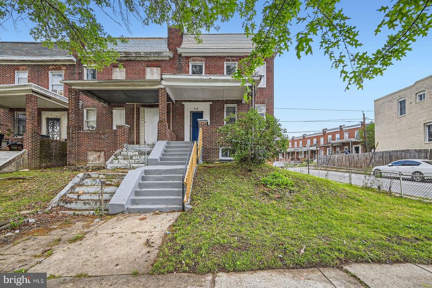Welcome to 118 N Hilton St – a spacious end-of-group townhouse situated on a prime corner lot! This home offers a traditional floor plan with a bright and airy living room featuring a charming faux fireplace and built-in shelving, a separate dining room perfect for gatherings, and a convenient half bath on the main level. The kitchen provides ample space for meal prep and entertaining.

Upstairs, you’ll find four generously sized bedrooms, including one with its own private balcony—ideal for morning coffee or evening relaxation. The primary bedroom features a large walk-in closet, and a full bathroom completes the upper level. Luxury vinyl plank flooring runs throughout the home, adding durability and modern style.

Outside, enjoy a partially fenced backyard with room to garden or entertain. The unfinished basement presents an excellent opportunity to create additional living space, a rec room, or extra storage. Recent updates include a newer roof and HVAC system.

This property is being sold strictly AS-IS. The seller will make no repairs, inspections are for informational purposes only. A great opportunity for buyers or investors looking to add value and personalize a home with strong fundamentals, generous square footage, and a desirable corner location in a well-established neighborhood.