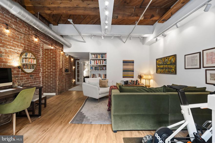 Welcome to 301 Race Street, Unit C002, a charming junior one-bedroom residence located in the iconic Wireworks Condominiums in the heart of Old City, Philadelphia. This home blends authentic architectural character with comfortable city living.

From the moment you enter, you're welcomed by soaring ceilings, exposed brick, and wood beams that create a warm and inviting atmosphere. Large windows overlook the beautiful courtyard, filling the home with natural light and offering a peaceful retreat in the middle of the city.

This thoughtfully designed junior one-bedroom layout accommodates a queen-sized bed while maintaining an open and airy feel throughout the living space. The home also offers two convenient access points, a courtyard entrance as well as entry through the building’s secured lobby.

The newly remodeled kitchen features a clean, modern design with updated finishes, making it both stylish and practical for everyday living. A cozy nook provides the perfect spot for morning coffee, dining, or a home office setup.

Recently installed designer flooring and new windows add to the home’s fresh, updated and well-maintained feel.

Residents of the Wireworks Condominiums enjoy a beautiful central courtyard, secure entry access, elevator service, bike storage, private storage lockers, and a professionally managed association, all within a pet-friendly community that celebrates the building’s historic charm.

Location is where this home truly shines. Situated in the heart of Old City, you're surrounded by cobblestone streets, historic landmarks, acclaimed restaurants, cafés, and art galleries. And nothing captures the neighborhood’s energy quite like First Fridays, when the streets come alive with art, music, and community. You'll also enjoy close proximity to Independence National Historical Park, the Delaware River waterfront, and easy access to public transportation, major highways, and Center City.

This lovely unit offers a rare opportunity to own a character-filled home in one of Philadelphia’s most historic and vibrant neighborhoods, where history, culture, and city living come together just outside your door.