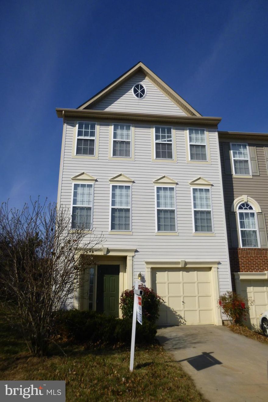 BIG END UNIT GARAGE TOWNHOUSE, GREAT LOCATION CLOSE TO I-95 AND ROUTE 1!  EAT-IN KITCHEN WITH ISLAND, SEPARATE DINING ROOM, HARDWOOD FLOORING ON MAIN LEVEL, WALK-OUT LOWER LEVEL WITH REC. ROOM AND GAS FIREPLACE, MASTER BEDROOM HAS VAULTED CEILING, WALK-IN CLOSET AND LUXURY MASTER BATH. NEEDS PAINT, CARPET AND A LITTLE TLC. PRICE IS PER FANNIE MAE'S LIST PRICE GUIDANCE.