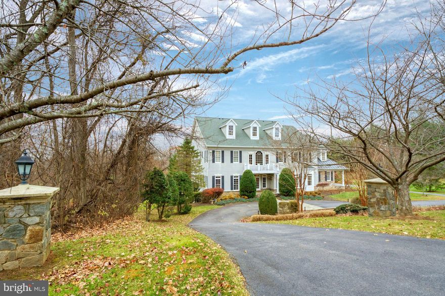 Introducing a refined estate in the esteemed community of Beacon Hill, peacefully nestled on more than three acres of lush, secluded grounds. This distinguished residence blends timeless architecture with elevated, thoughtfully selected updates to create a lifestyle of effortless luxury. Impeccably manicured landscaping, elegant stone hardscapes, and a shimmering pool and spa establish an inviting outdoor oasis, enhanced by dual covered porches designed for year-round enjoyment and sophisticated entertaining. Inside, the gourmet kitchen serves as the home’s centerpiece, featuring new chef-caliber appliances, sleek flooring, and designer lighting that together cultivate a stylish, inspiring environment for both culinary creativity and relaxed gatherings. The expansive walkout lower level extends the home’s versatility with a well-appointed wet bar, open recreation areas, and a spacious bonus room that easily adapts to guest accommodations, office use, fitness, or hobbies. The serene owner’s suite offers a cozy fireplace, private deck, generous walk-in closet, and spa-inspired bath that together create a true sanctuary. Throughout the home, abundant natural light pours through large windows, illuminating the sophisticated interiors and enhancing the sense of warmth and comfort. A three-car garage, contemporary updates, and exceptional privacy complete this remarkable offering—a harmonious blend of elegance, modern convenience, and resort-style living within one of Loudoun County’s most prestigious communities.