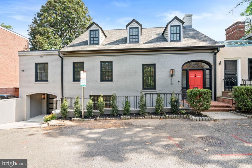 Ideally located in the heart of Georgetown’s East Village, this stunning mid-century residence has been meticulously and completely transformed through a full renovation, showcasing premium fixtures and finishes throughout its highly functional and desirable floor plan. No detail was overlooked in the spectacular renovation of this home, which epitomizes luxury, sophistication, and elegance. As you step into the marble-inlaid foyer, a dramatic glass-railed staircase, illuminated by a contemporary light fixture, gracefully introduces you to the home's various levels, which can also be accessed from the elevator. The main level offers an open and airy living room, complete with wide plank white oak floors, a gas fireplace, built-in shelving and cabinetry, a wall of full glass doors, and access to the large rear terrace. The gourmet chef’s kitchen is well-appointed with a large center island with a striking Calacatta Prado Quartz  countertop, a top-of-the-line Miele appliance package, an attractive La Cornue oven and range, and white oak custom cabinetry. A spacious walk-in butler’s pantry offers access to the glass enclosed wine cellar, and the kitchen flows seamlessly into the dining room, which also opens onto the rear terrace. This level also features a convenient mudroom with cubbies, a full bathroom, and direct entry to the garage.  On the second floor, the luxurious primary suite includes wide plank white oak floors, a gas fireplace, and a large balcony overlooking the private and expansive grounds. The spa-like marble bathroom offers dual vanities, an oversized frameless glass shower with dual showerheads, a large separate soaking tub, and heated floors. The primary suite is complemented by an impressive walk-in closet with an abundance of shelving and storage. This floor also includes an additional bedroom suite with a private bathroom and large closet. Additionally, there is a beautiful family room/library with wide plank white oak floors, built-in bookshelves, a large gas fireplace, and balcony access. The top floor provides two additional bedroom suites, each with large closets and attractive en-suite marble bathrooms with heated floors. The lower level provides ample storage space, a gym area, a laundry room, and elevator access. The exterior of the residence is perfect for entertaining, featuring a large pool with a swim-up bar, multiple terraces for dining, a built-in grilling station, a putting green, and beautifully landscaped gardens and grounds that are expansive and private. This spectacular residence is luxury living in Georgetown at its finest, boasting modern amenities and convenient proximity to neighborhood favorite restaurants, shops, and parks.