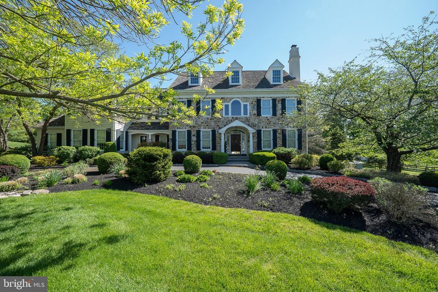 315 Blackburn is a stately stone manor home situated within the prestigious Main Line community of Saybrook. This custom home was designed by Anne Capron and built with the Bentley Homes signature of elegance and impeccable quality.  Featuring  5 bedrooms,  3. 3 baths,  10 foot first floor ceilings and on site finished hardwood flooring, this timeless floor plan blends a relaxed charm of intimacy inviting family togetherness. The lot is professionally landscaped with lawns, perennial gardens and a  graceful circular driveway to greet your  guests. The first floor features a front to back center hall Foyer with a grand turned Staircase and landing. The Living Room and Dining Room display craftsman details such as  two-piece crown molding, stately 7.5 inch baseboards and deep window sills. The Living Room fireplace has a floor to ceiling raised panel mantel. The handsome Study is detailed with natural cherry woodwork and a window seat. The designer Kitchen has solid wood cabinetry by Kountry Kraft  and offers a large island with seating, plenty of counter space and a large pantry.  The Wolf 6 burner cooktop, Wolf double ovens, Sub-zero refrigerator and Asko dishwasher will satisfy any foodie’s passion.  The sun filled Breakfast Room has access to the rear flagstone patio.  A Butler's  Pantry with wet bar and wine cooler complete the entertaining hospitality. Designed for today’s lifestyle, the open Family Room has a full height field-stone gas fireplace and a full wall of built-ins. The “everyday” back foyer has a convenient 2nd powder room and Bentley's signature built in cubbies with coat hooks and shelving. 

Ascending to the second floor you’ll experience luxury in the Primary Bedroom suite appointed with a Sitting Room, double walk-in closets , marble bath with glassed in shower, Jacuzzi tub, two separate vanity areas and a separate toilet room.  The hallway leads to 4 additional Bedrooms, 2 more full Baths and the convenience of a second floor Laundry.  There is a separate back staircase with overhead skylight that circulates  back down  to the Kitchen.   Another set of oak stairs lead to the daylight, walk-out Lower Level featuring a Recreation/Game Room, Sitting/TV Area, temp-controlled  custom cedar wine cellar and powder room.  Copious storage abounds in the  large unfinished area which houses a brand new  high efficiency Carrier furnace and two  75 gallon high efficiency gas water heaters as well as 400 amp electric service.  Other exceptional features include a whole house  36 kilowatt generator, a  holiday light package with timer for all windows throughout,  professional landscaping with perennial gardens, built-in lawn & garden irrigation system, stone patio and large flat rear yard for entertainment and play.  

Saybrook's coveted location is convenient to major highways, upscale shopping boutiques, sophisticated dining and historic attractions. It is serviced by the award winning Tredyffrin/Easttown School District, known for its dedication to outstanding educational performance.  Recognize an exceptional investment  and come home to 315 Blackburn Drive.