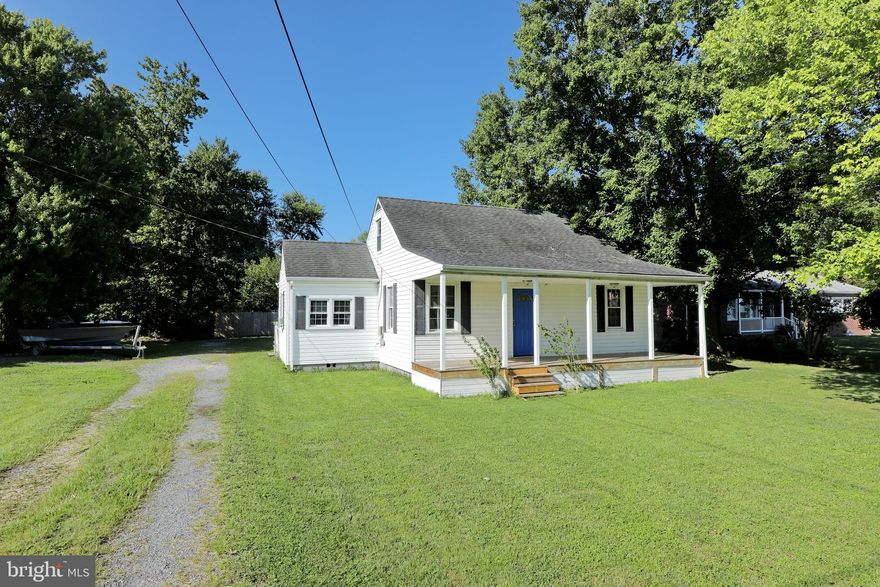 Charming cottage style home with plenty of character and front porch for summer nights relaxing. This 3 bedroom 1 bath home has the perfect feel once you walk in the front door. As you enter the living room you will see hardwood floors are throughout the main level. The kitchen is generous in size and offers ample countertop space. There is also space in the kitchen for dining table. The separate laundry is off the kitchen on the main level and has a back door entrance from the deck. There are 2 bedrooms on the main level that are at the end of the home and have lots of natural daylight. The hallway bath offers a tub/ shower combo. The 3rd bedroom is upstairs and  can also be used for a great rec room. Outside you will find a carport next to the back deck and leading up to the backdoor of the home. The workshop has electric and has been used as a wood working shop in the recent years. There is a greenhouse attached to the back of the workshop and it offers a separate entrance behind the fence line great for growing vegetables and plants in the winter. The backyard has a 6' privacy  fence and lined with all sorts of fruit trees and plants. Finally a dog kennel is in the backyard.