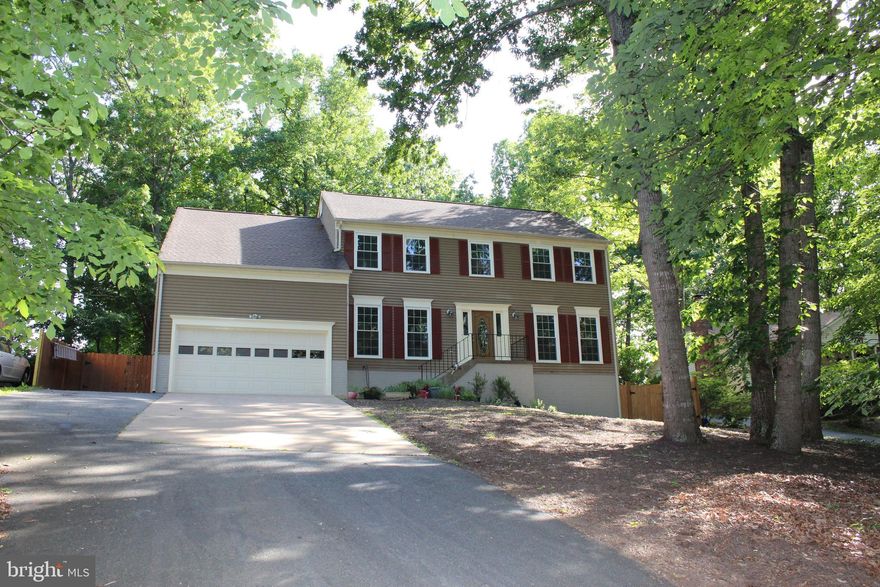 Beautiful Colonial, New kitchen with Granite & Stainless Appliances, all baths updated, new carpet, Hardwood Floors in Family Room, Dining Room, Stairs, Upper Hallway and Master Bedroom, 30 year roof that is 3 years old, New Gutters 2 years old,  New windows 1 year. Large Deck with entry from both the family room and the kitchen area, fully fenced Rear yard and shed. Master Bedroom Sitting Area can be used as a 5th Bedroom.