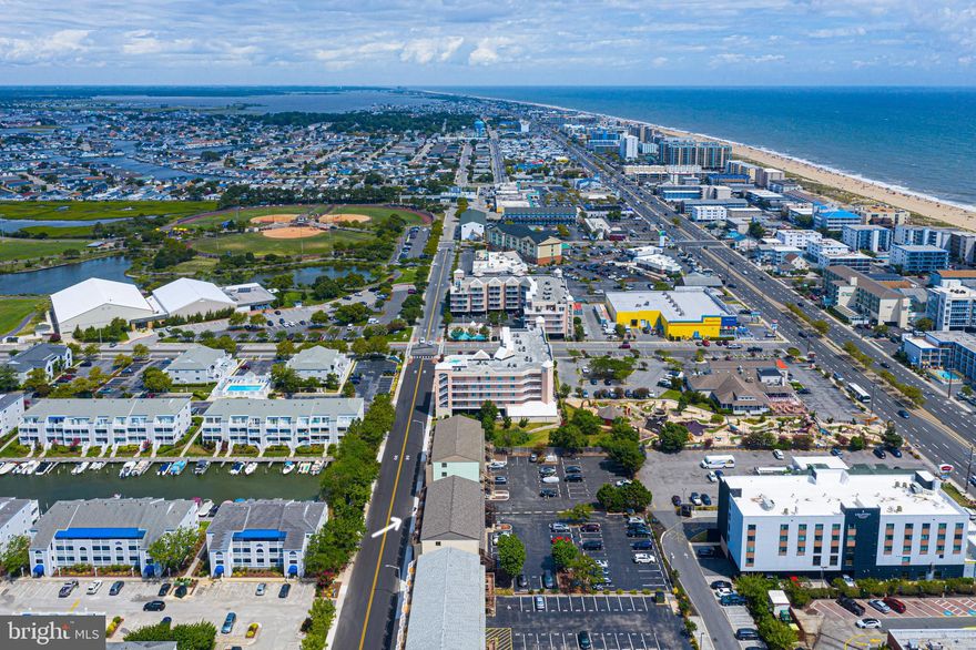 ENJOY the GOOD LIFE!  Relax and enjoy the  water view  from the large balcony! Location, Location, Location!  This gem is not far from the beach, and close to the bay!  Large Living area features slider with access to the  balcony.  Enjoy the sweet salty air,  the water view and let the sun shine in!  Convenient kitchen equipped with breakfast bar, to relax and dine while enjoying the open floor plan.  Recess lighting.  Custom flooring throughout.  Spacious bedroom enhanced with large window.  Bathroom has custom updates, with upgraded walk in shower.   Washer & Dryer.  This is just what you have been waiting for!  Ready to go!  Comes furnished!  So get ready to enjoy life, right here!  Great Rental potential, or Enjoy it for yourself!