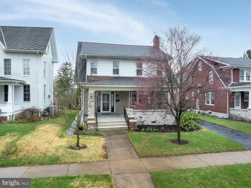 They truly don’t build them like they used to! This classic 1923 Craftsman home has all the charm of a bygone era and all the modern comforts of today! As you step through the front door you’ll be captivated by the character of this beautifully preserved home beginning with the original wood floors that sweep through the first floor, up the handsome, dual-sided staircase and into the 4 large bedrooms. The main floor offers a warm and inviting living room with a cozy gas fireplace insert, seamlessly connected to the traditional dining room by original glass-paneled folding doors. The kitchen is a standout, thoughtfully updated with quartzite  countertops, stainless steel appliances, and a spacious island ideal for cooking, dining, or gathering. Just off the kitchen, you'll find a stylish powder room, a convenient main-floor laundry room, and a practical mudroom for everyday ease. Enjoy relaxing evenings on the classic front porch or host guests in the newly added backyard retreat—complete with a large patio and pergola. Additional highlights include central heating (natural gas) and air conditioning, a newer roof a functional walk-up attic, raised garden beds, and a large unfinished basement, perfect for a workshop or additional storage! So much to love about this very special home. Schedule your tour today!