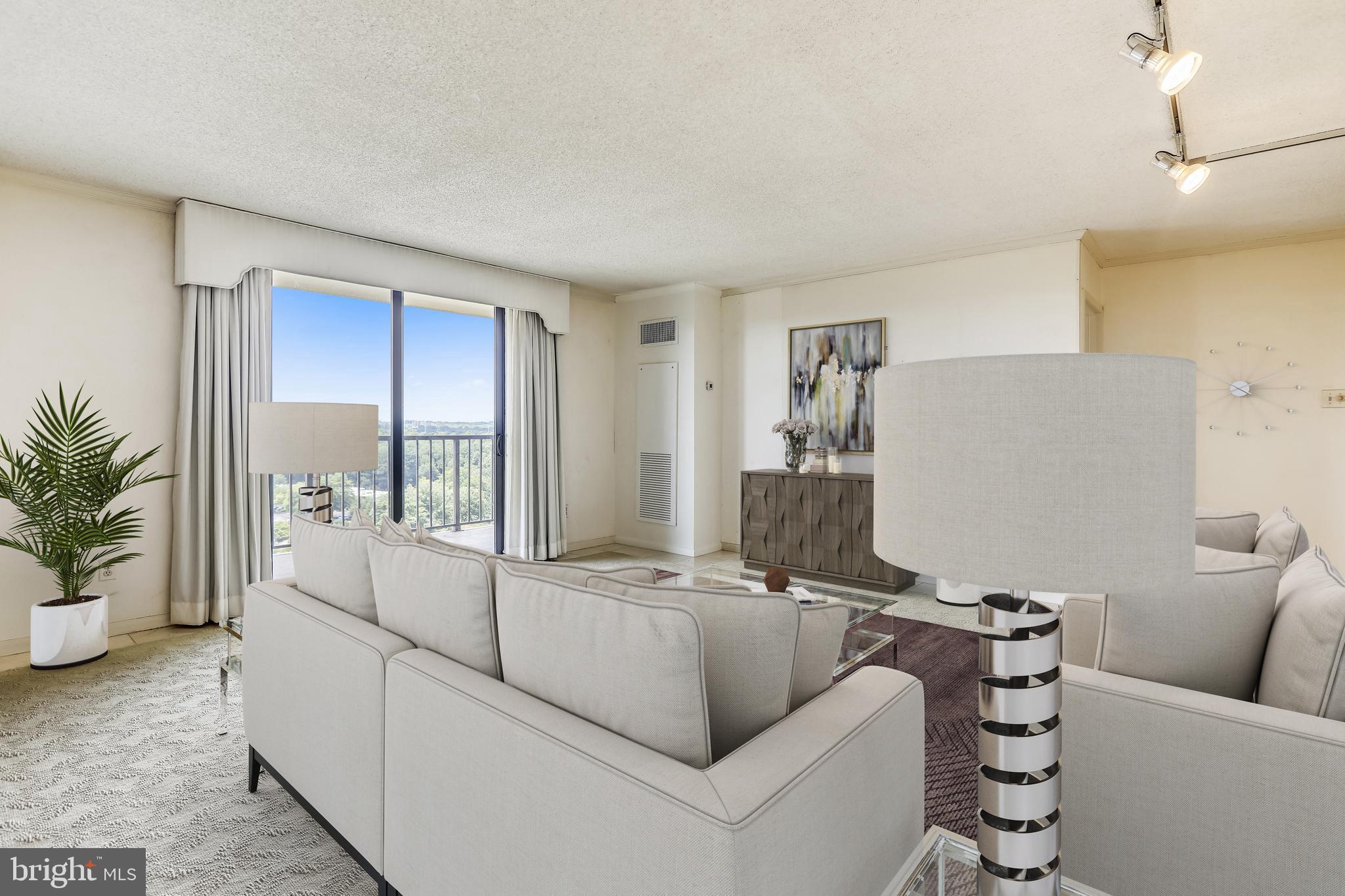 Welcome to an end unit condo which is currently a two bedroom. The third bedroom was opened up and is used as a den. The kitchen has eat-in space with a built in breakfast table. The living room, den and dining room all have great light and open to the balcony. The vista view is beautiful from the large balcony. The 2nd bedroom is used as an office. The entire unit makes great use of space with lots of built-in cabinets. Westlake Towers is conveniently located within walking distance of the Westfield Mall, other shops, restaurants, and Cabin John Park. You cannot beat the location for commuting and it is a quick hop to Metro. There is a pool, tennis courts, exercise room, card room, party room and a rooftop terrace. This unit has one underground parking space and a storage room. All utilities included in condo fee.