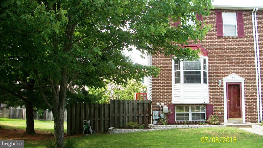 Gorgeous end unit townhouse in Aspen Park.  Fenced in back and side yard!  All new wood floors, paint, lighting, trim & carpet.  Split Foyer style home with large breakfast bar overlooking spacious dining area.  Newly stained deck with stairs to back yard. Finished lower level with walkout to covered patio area. Lots of storage space. Easy commute to Baltimore, Annapolis & Fort Meade