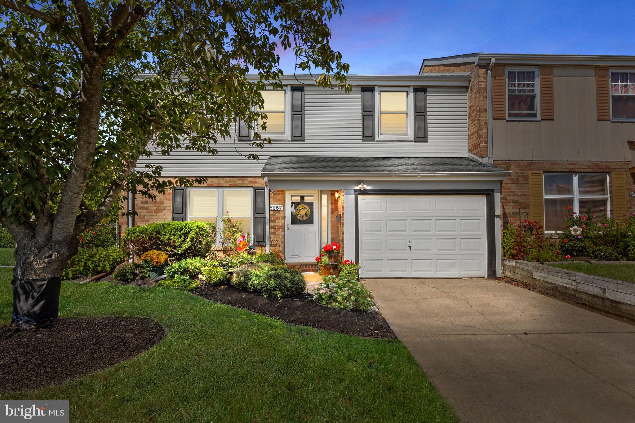 Welcome to 6257 Nathan Hale Court in Neshaminy Valley! This end-unit townhome offers 3 bedrooms and 2.5 baths, tucked away at the end of a quiet cul-de-sac on one of the largest lots in the community. Step inside to find an open and seamless first floor with updated luxury LVP flooring throughout. The kitchen has been beautifully updated with white shaker cabinets, granite countertops, stainless steel appliances, a white subway tile backsplash, and an oversized custom bar with additional storage—perfect for entertaining. The family room features a cozy gas fireplace with a whitewashed brick surround. The first floor also includes laundry, a convenient half bath, and access to the attached garage, complete with custom shelving and an epoxy-coated floor for a polished workspace. Upstairs, the updated hall bath features a tiled tub/shower combo and oversized vanity. The spacious primary suite boasts a walk-in closet with custom built-ins and a modern ensuite bath with a tiled walk-in shower, glass doors, and another oversized vanity. Two additional bedrooms with wall-to-wall carpeting and large closets complete the second level. The backyard is your private retreat, featuring mature landscaping for privacy, a covered patio perfect for outdoor dining, and a brand-new walk-in shed for long-term storage. Located in highly desirable Neshaminy Valley, this home offers easy access to major roadways for commuting to Philadelphia and beyond. NEW (2024) HVAC!