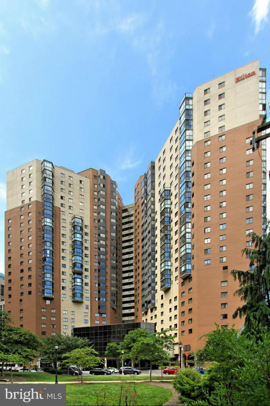 Panoramic View from this rarely available floor plan. Glass enclosed terrace accessible from LR and BR. One reserved Garage space G4-192, included. New hardwood floor, stacked Washer/Dryer, tiled kitchen with granite counter tops, new cabinets and stainless steel appliances, completely new tiled bathroom with a luxurious shower. Ballston Metro stop in the basement of the building. Gym, Party Rm