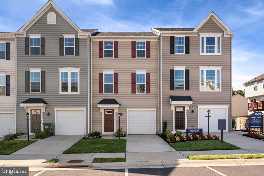 Welcome to this stunning 3-level townhome that offers a perfect blend of comfort and style. Built in 2021, this spacious Mozart model boasts 1,960 Sq ft with 3 bedrooms and 2.5 baths, complete with a garage, deck, and fenced in backyard. This home is also equipped with Ryan Smart Built technology to include top of the line insulation on all doors and windows and helps reduce your energy bill!  As you enter the home you enter into the foyer leading to the lower level which can be used as a play room, office, or entertainment space. The lower-level walk out leads to the patio and fenced in backyard.
The heart of the home is the expansive kitchen, adorned with elegant granite countertops and huge island that beautifully complement the modern design. The kitchen is complete with Energy Star Stainless Steel appliances, large pantry, and cabinet crown molding and large dining space. Just off the kitchen you can step outside onto the maintenance free Trex deck, perfect for relaxing or hosting gatherings. You will notice recessed lighting in the living room with lots of natural light. The main bedroom adorns a tray ceiling, large walk-in closet and bathroom with double vanity and shower. The laundry is conveniently located on the upper level. Luxurious LVP flooring in the kitchen, bathrooms, and basement entrance. The fenced-in backyard offers privacy and a safe haven for your kids and pets. The backyard and stamped patio located right outside of the basement adds extra space to relax and entertain your guests. With its thoughtful layout and upscale features, this townhome is a true gem for those seeking a harmonious blend of sophistication and functionality. Wilderness Shores HOA amenities include pool, clubhouse, paved trails, and playground/tot lot! BONUS Trash and front lawn mowing are included in the HOA!