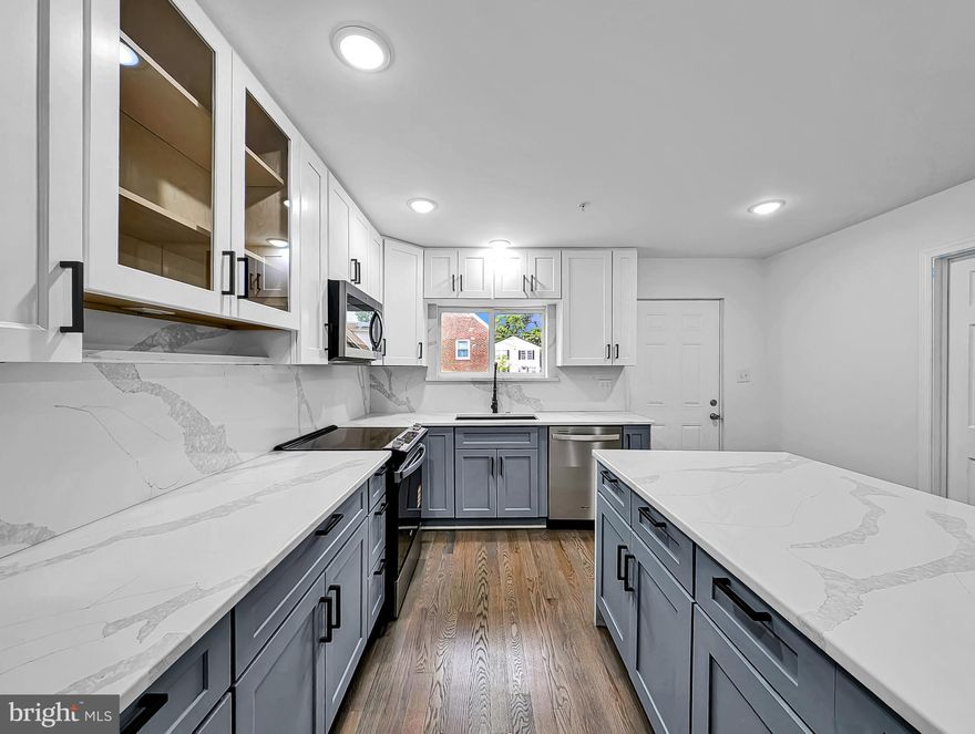 Completely remodeled and thoughtfully updated, this expansive home offers bright, light-filled interiors and an open, functional layout throughout. The main level features a spacious open-concept kitchen, dining, and living area designed for comfortable everyday living and entertaining, along with 2 bedrooms and 2.5 bathrooms.

The upper level includes 4 additional bedrooms and 2 full bathrooms, highlighted by an oversized primary suite with a luxurious spa-like bath and generous space throughout.

The fully finished walkout basement offers abundant additional living space, complete with daylight windows, a kitchenette, and a full bathroom — ideal for guests, extended living, or recreation.

Outside, the property features both a long side driveway, providing ample parking and convenience.