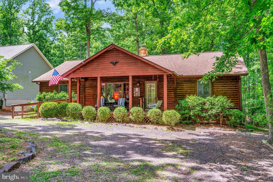 Truly that 'cabin-in-the-woods' look & feel. Richly appointed vaulted  pine ceilinged living & dining rooms boast hard wood flooring and log-look interior walls .  A convenient ramp is the access to the covered front porch (8 x 22) with another ramp into the front door.  Open the door to experience a simpler and cozy layout. The living room has a desk center & display area with built-ins plus a stone wood burning fireplace with a raised hearth perfect for a quick warm-up on a cool nite. Each of the bedrooms has log wall accents. This is a split bedroom floor plan one level living home.  The home has plentiful storage closets & attic space. Off the rear deck (12 x 16) is a large backyard for extended outdoor living.
2019 new roof by Roof Works of Va; 2018 new heat pump (seer 14, 2 ton) ; Nov 2019 Chimney Sweep repair & duct Clean.
Floral plantings are spectacular in bloom season: camelias, azaleas, rhododendroms, peonies!!!
Notice: Occupant was a smoker.