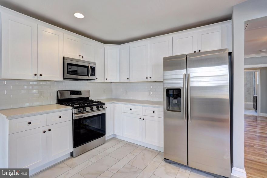 Beautiful Home, Over 2000 sf on one level featuring 4 large bedrooms and 2 1/2 bathrooms!  Gorgeous hardwood floors throughout home, beautiful woodwork, top of the line kitchen that opens to the living room!  You'll find a charming from porch, plenty of parking and a nice back yard!  Don't miss out!