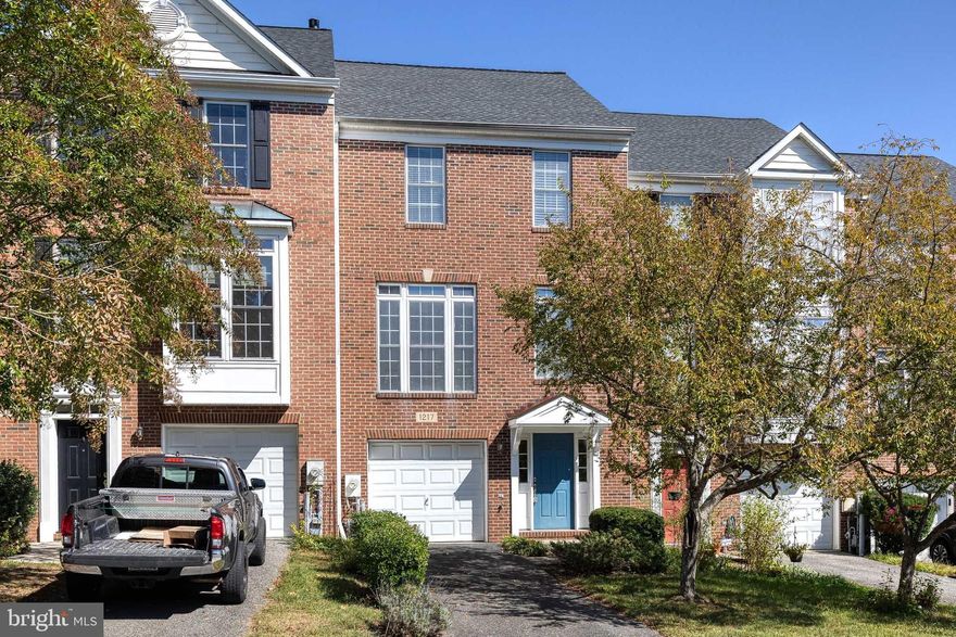 Welcome to this beautifully maintained brick-front garage townhouse in the highly sought-after Crofton Manor community! Featuring 3 bedrooms, 2 full baths, and a half bath, this spacious home blends comfort, style, and convenience in a prime location. Step inside to find beautiful luxury vinyl plank flooring, gleaming hardwood floors and fresh paint throughout. The entry-level offers access to the attached garage and a versatile family room with walkout access to the fully fenced backyard.  The main level features an open-concept floor plan, showcasing a bright and airy living and dining area, a convenient powder room, and a chef’s kitchen complete with granite countertops, double ovens, an island with cooktop, and a versatile  breakfast/family room with gas fireplace. Sliding glass doors open to a private deck, ideal for entertaining or relaxing. The upper level is complete a luxurious primary suite with vaulted ceilings, a walk-in closet, and a ensuite bath featuring a double vanity, soaking tub, and separate shower. Two additional bedrooms also feature vaulted ceilings, generous closets, and share a full hall bath.  Located just minutes from major commuter routes, schools, shopping, dining, and easy access to Washington D.C., Baltimore, Annapolis, and Fort Meade, this home offers the perfect blend of modern living and accessibility. Don't miss your chance to call this Crofton gem your new home!