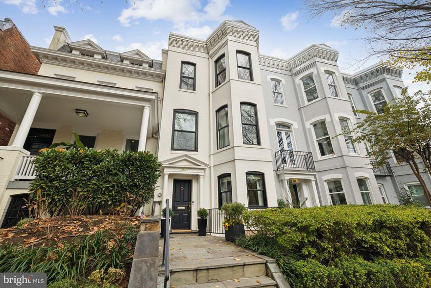 Discover charm and sophistication in the heart of Georgetown’s East Village with this spectacular 4-story Victorian style rowhome. This 5 Bedroom, 4.5 Bathroom residence boasts great details, including the hardwood floors, custom built-ins and high ceilings. The Main Level offers a Formal Living/Dining Room and opens up to a spacious eat-in Kitchen overlooking the well landscaped, private rear patio. The Mudroom located just off of the Dining Room and outdoor Patio is a great place for storage. The Upper Level is dedicated to the Primary Suite with high ceilings, a large walk-in closet, second Washer/Dryer, sizeable Primary Bathroom, and private Terrace in addition to a spectacular secondary Family Room with beautiful built-ins, a fireplace and oversized windows providing an abundance of natural light. The Top Floor is home to 3 additional large Bedrooms with 2 en-suite Bathrooms and monument views! The Lower Level is the perfect Nanny Suite with a separate entrance and full Bath. This meticulously upgraded home seamlessly blends historic charm with modern amenities for the ultimate Georgetown living.