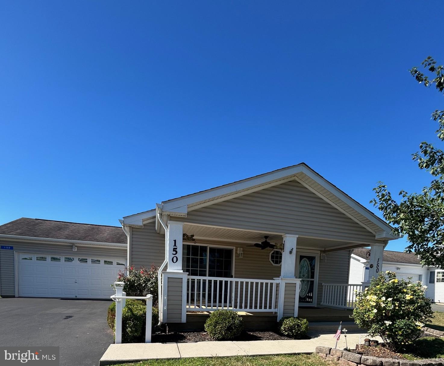 Location!Location!Location!! Walking distance to Club House, near front of Douglass Village entrance!! Adult 55+ community. Popular Willow Model, 3 Bedrooms,2 full Baths, 2 car garage, 20' Front Porch with Synthetic decking. Also rear porch. Kitchen to include double S/S sink, garbage disposal, Gas cook top range, wall oven with built in Microwave on top. Lots of pantry space with sliders to Deck. Living Room with Stone Gas Fireplace with built-in TV . Primary Bedroom with walk in closet and Bathroom attached with a 5' walk-in shower with bench seating. Lot lease includes all the amenities of the Club House to include lots of daily activities, grass cutting, snow removal on streets and sidewalks, Heated Swimming Pool, Gym with flat screen TV, gathering room, game room. More pictures to follow, just freshening up. This Home will not last long!!
