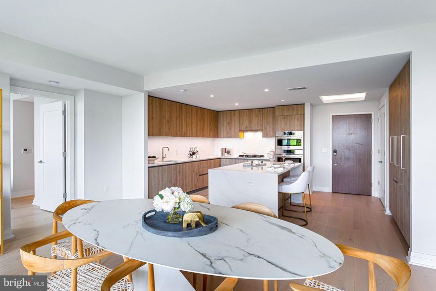 BRAND NEW Two Bedroom/Two Bathroom Model just released at North Old Town’s most luxurious and exclusive luxury condominium building, MUSE.  Condo 208,  is an open concept floor plan and designed to utilize every inch with purpose. This home offers  9’ ceilings, an expansive private balcony with a view of the Potomac River, and an abundance of natural light with walls of floor-to-ceiling windows.  There is more than enough storage in the kitchen with a generous amount of kitchen cabinets,  two pantries and an expansive island.   Two walk-in closets in the Owner's room, one in the 2nd bedroom, and a spacious laundry room ensures plenty of closets and storage throughout the condo.

Built by renowned local developer, Carr Companies, the finishes in this building are extraordinary, with a myriad of layouts to suit your lifestyle. Clean lines and light textures unite the welcoming chef’s kitchens equipped with panelized Bosch appliances, Quartz countertops, vast island space including an incorporated wine fridge, and ample storage with custom Italian flat panel wood cabinetry from Snaidero! All homes feature recessed lighting, and window treatments, Waterworks fixtures, Calacatta porcelain tile and hard wood floors.

MUSE offers a turn-key elevated lifestyle. Enter into our Grand Lobby, where you will be met by our daytime porter, Full-Service 24-hour Concierge, and on-site building manager and engineer to assist with your every need. Designed to elevate the most discerning modern lifestyle, the rooftop clubroom offers endless entertainment options with expansive views of the DC Monuments, Potomac River, and Old Town Skyline. Whether warming by the fireplace, refreshing at the bar in our indoor Owner’s Watercolor Lounge, or sojourning in solitude, this bright space transitions seamlessly into the outdoors with floor-to-ceiling windows that open up to ample terrace areas. Bask in the waterfront breeze while firing up the grill or relax in chic lounge seating while enjoying panoramic views. Energy abounds in the Penthouse-level fitness and yoga studios featuring state-of-the-art equipment and cutting-edge technology. Complete with an outdoor fitness terrace, there’s no shortage of options to relieve your stress and stay in shape. 

MUSE is the ideal location in North Old Town's,  Alexandria's newest Arts District,  with direct access to the Mount Vernon Trail and a stone’s throw from DC. Come see what all the fuss is about! Immediate Occupancy available. 

Muse also has additional  2 bed 2 bath floor plans available.  Some photos are of our model and similar floor plans.