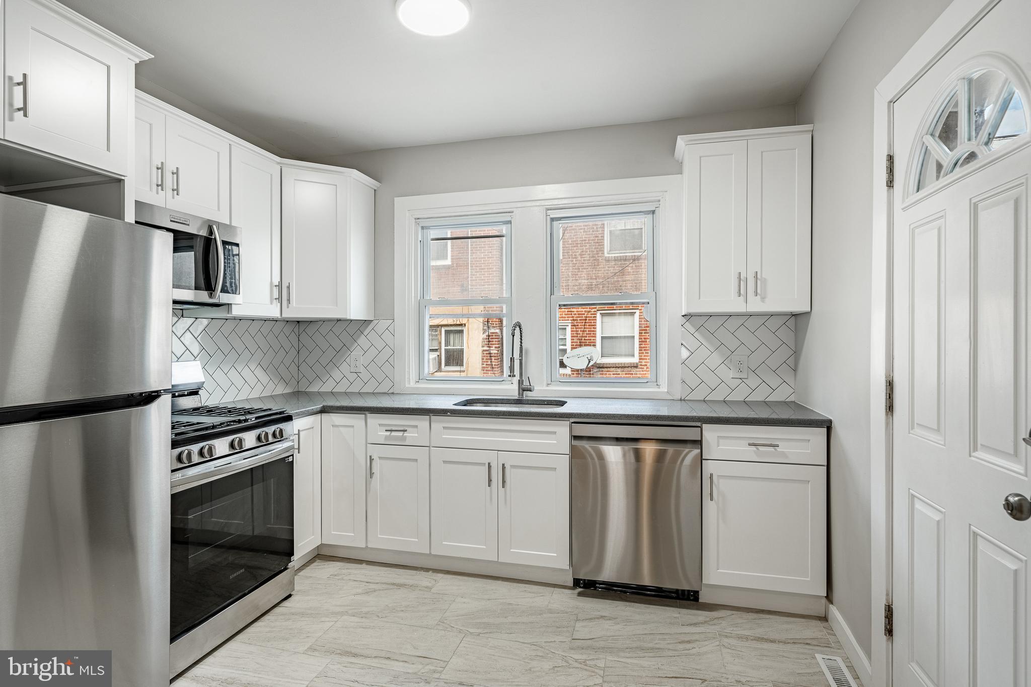 **Welcome to 1647 S Wilton St – Southwest Philly’s Hidden Gem!**
Tucked away in a quiet pocket of Southwest Philadelphia, this beautifully reimagined home is a true diamond on South Wilton Street. Just two blocks from convenient trolley and bus routes, with lightning-fast access to I-76 and all the best of Center City, this location is both relaxed and superbly connected.
Step inside to a blend of classic character and fresh, modern upgrades. The original hardwood floors have been lovingly refinished, offering warmth and timeless style throughout. The sun-drenched rehabbed sun porch illuminates the first floor, while the spacious living area gleams under brand new recessed lighting, setting the perfect mood from day to night.
The kitchen is a total showstopper – completely renovated with sleek finishes, contemporary cabinetry, and brand new LG appliances, ready for your culinary creativity. And the bathroom? Spa vibes only – with a gorgeous backlit, anti-fog mirror that turns every morning routine into a luxurious experience.
Enjoy comfort in every season with a brand-new HVAC system, plus peace of mind with new plumbing, new window capping, and washer/dryer hookups in the basement. Ceiling fans in each bedroom keep things cool and breezy all year long.
Whether you're a first-time buyer or just looking for a move-in-ready upgrade in a quiet, connected neighborhood – 1647 S Wilton is the one you've been waiting for.
Don’t just take my word for it – come see it in person!