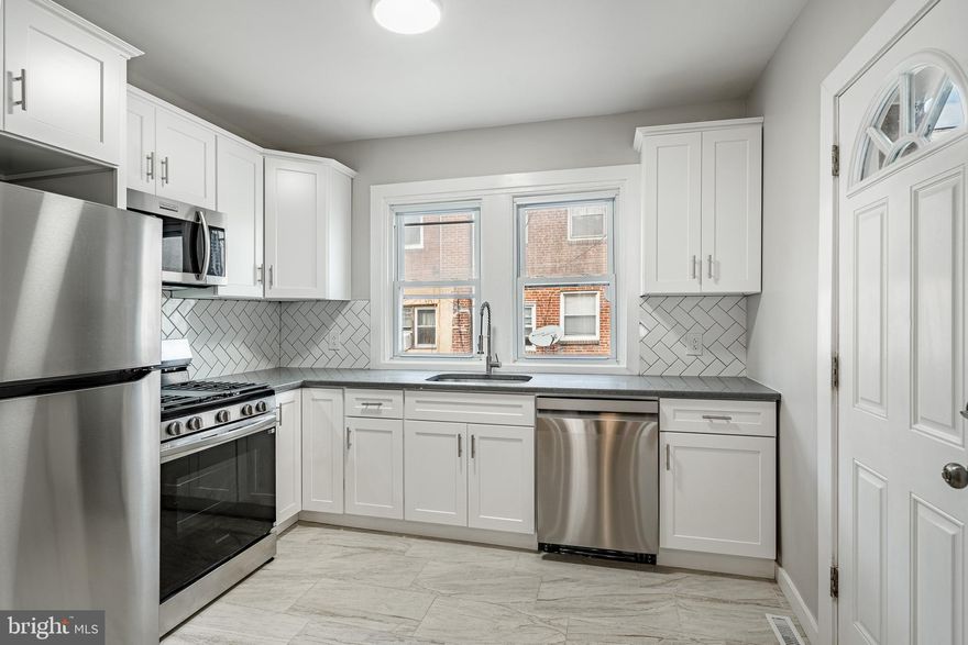 **Welcome to 1647 S Wilton St – Southwest Philly’s Hidden Gem!**  

Tucked away in a quiet pocket of Southwest Philadelphia, this beautifully reimagined home is a true diamond on South Wilton Street. Just two blocks from convenient trolley and bus routes, with lightning-fast access to I-76 and all the best of Center City, this location is both relaxed and superbly connected.  

Step inside to a blend of classic character and fresh, modern upgrades. The original hardwood floors have been lovingly refinished, offering warmth and timeless style throughout. The sun-drenched rehabbed sun porch illuminates the first floor, while the spacious living area gleams under brand new recessed lighting, setting the perfect mood from day to night.  

The kitchen is a total showstopper – completely renovated with sleek finishes, contemporary cabinetry, and brand new LG appliances, ready for your culinary creativity. And the bathroom? Spa vibes only – with a gorgeous backlit, anti-fog mirror that turns every morning routine into a luxurious experience.  

Enjoy comfort in every season with a brand-new HVAC system, plus peace of mind with new plumbing, new window capping, and washer/dryer hookups in the basement. Ceiling fans in each bedroom keep things cool and breezy all year long.  

Whether you're a first-time buyer or just looking for a move-in-ready upgrade in a quiet, connected neighborhood – 1647 S Wilton is the one you've been waiting for.  

Don’t just take my word for it – come see it in person!