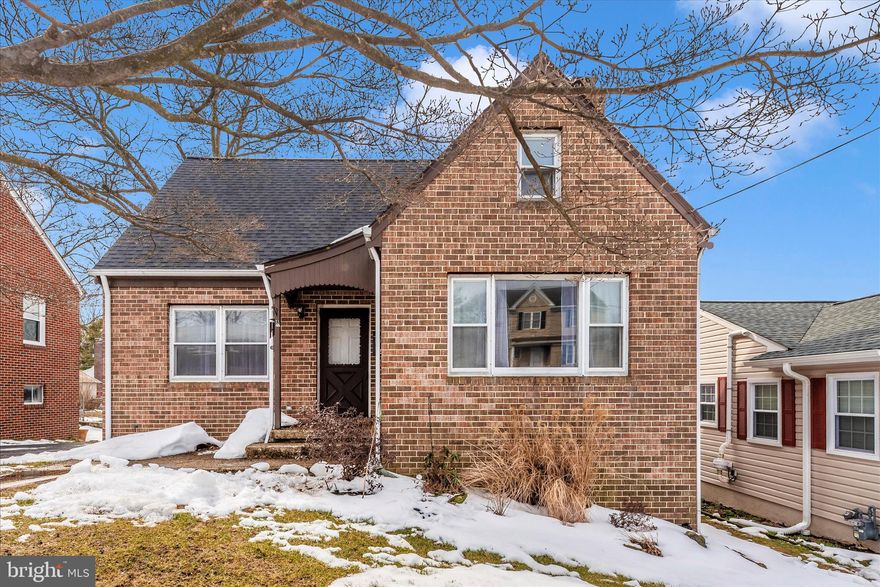 Charming All-Brick Cape Cod with First-Floor Bedroom!!!  Welcome to this solid all-brick 3-bedroom, 1½-bath Cape Cod offering classic character and comfortable living. The inviting living room features a cozy fireplace—perfect for relaxing evenings at home.

The eat-in kitchen provides ample space for everyday meals and gatherings. A convenient first-floor bedroom and powder room adds flexibility and ease of living, ideal for guests, a home office, or single-level living needs. Two additional bedrooms and a full  bath complete the home’s thoughtful layout.

The partially finished lower level offers extra living or recreation space and includes a flue for a woodstove, presenting additional heating possibilities. A level walkout provides easy access to the backyard.

Step outside to enjoy the covered rear deck overlooking the yard—perfect for outdoor dining or quiet mornings. A storage shed adds convenience for tools and equipment. Connected to public water and sewer for added peace of mind.

This well-maintained Cape Cod combines timeless appeal with practical features—ready for you to make it your own.