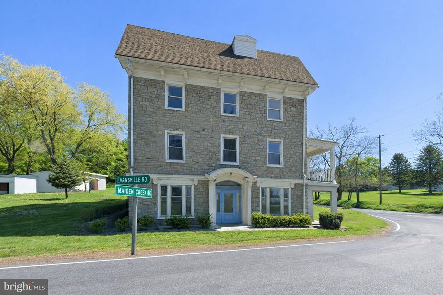 Exceptional 15+ acre mixed-use investment opportunity at 384–388 Evansville Rd, Fleetwood, ideally positioned at the corner of Maiden Creek & Evansville Roads with commercial zoning along the first 200’ of frontage . The property offers subdivision potential along the commercial corridor and features a fully renovated 4-story, 19-room, 7-bath stone building with elevator access, updated electrical and plumbing systems, fire safety compliance, and a 600K BTU multi-zone heating system. Attached yet fully independent is a 3-story, 5BR/2BA stone residence with 3-car garage and private outdoor space. A newly permitted on-site sewage plant (approx. $350K investment) is already installed, providing meaningful infrastructure value. Suitable for multi-unit residential conversion, professional or medical office use, group housing, or mixed-use repositioning. A rare large-parcel asset offering flexibility, existing improvements, and long-term upside in a prime Berks County location.