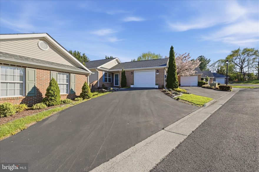 Tucked away on a quiet cul-de-sac in the desirable Stonecrest Village community, 419 Stone Meadow Court offers a perfect blend of comfort, style, and convenience. Built in 1997 and thoughtfully maintained by its single in-residence owner, this charming home features easy one-level living with a spacious, light-filled layout ideal for both everyday living and entertaining. Recent updates include fresh interior paint, new kitchen flooring, a new HVAC system, and refreshed landscaping and mulch.
Built by Oakcrest Builders, this unit is the Andover floor plan with the sunroom option, offering 1132 sq ft with carpeting throughout bedrooms and living/dining area. The galley-style kitchen is efficiently designed and updated with stainless steel appliances, vinyl flooring, and includes enclosed washer and dryer units. The open living and dining area creates an inviting space for gathering, with direct access to a private deck - perfect for relaxing or entertaining. A bright sunroom also opens to the fenced garden, offering a peaceful retreat filled with natural light. Generously sized bedrooms provide comfortable accommodations, while an oversized one-car garage and off-street parking for two additional vehicles add everyday convenience. Pull down attic access offers more storage.
Residents of Stonecrest Village enjoy access to the community center, along with planned activities that foster a welcoming neighborhood atmosphere. HOA fees cover common grounds maintenance and landscaping, including snow removal and street maintenance, adding ease and convenience to daily living. Conveniently located within Winchester City, this home is just minutes from local shops, dining, parks, and commuter routes, delivering the best of low maintenance living in a prime location. With just 34 homes in the community, it is truly a hidden gem!
Please note:  the owner requests that you kindly remove your shoes when viewing, or utilize the provided booties.  White carpeting has just been cleaned.