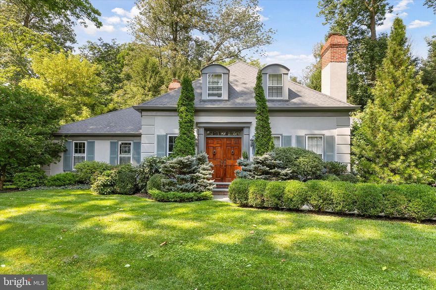 Ideally located on a quiet cul-de-sac in Bryn Mawr, this right-sized Colonial home will be your private oasis. Enter into a grand foyer with views straight through to the sunny rear yard.  The adjacent formal Dining Room features a gas fireplace, built-ins, and plantation shutters. A pocket door leads from here to a small hallway. Cabinetry for barware and serving needs, as well as a built-in work station flank one wall, while opposite that is a convenient pantry / mudroom with ample storage and access to the 2 car garage. The gleaming white Kitchen features divided-light glass front upper cabinets, crown molding, granite counters, and recessed and pendant lighting.  A large center island with an undermount stainless sink and Bosh dishwasher provides casual seating. Double ovens (GE Profile), a Wolf 5-burner stove and custom hood, and a side-by-side Sub Zero refrigerator/ freezer will delight your inner chef.  A renovation by the current owner opened the Kitchen to the Great Room, which is accented by classic columns.  Two pairs of French doors lead to a beautiful bluestone terrace out back. The Great Room comes compete with a gas fireplace, surround sound, and built-in bookshelves and cabinets. The FIRST FLOOR Primary Suite is set off from the main living area.  Here you will find abundant closet space, a separate dressing area, a large, sunny bedroom, and the Primary Bath. A half bath / laundry room complete the first floor. Upstairs are two additional bedrooms,  each generously sized, with two closets, dormered windows and a ceiling fan. The hall bath has a tub / shower, a large linen closet and a granite-topped vanity. Attic space provides plenty of additional storage. The carpeted lower level of the home is well suited as a Family Room, home office, or gym. It has been waterproofed and has an air-circulation system. Bring home your goodies from the Bryn Mawr Farmer's market, and grill up something fabulous for family and friends on the bluestone terrace out back. Mature trees and plantings frame this private spot, perfect for dinner al fresco, or a morning cup of coffee with a good book. A convenient motorized awning can be put to use on hot Summer days. Living here you will enjoy the best of both worlds: a quiet respite from everyday life and a convenient location in Lower Merion Township, near schools (walk to Harriton High), colleges and Universities, parks, the Bryn Mawr train station, and all that the Main Line has to offer. Just minutes to Center City. The home comes with a whole-house generator.