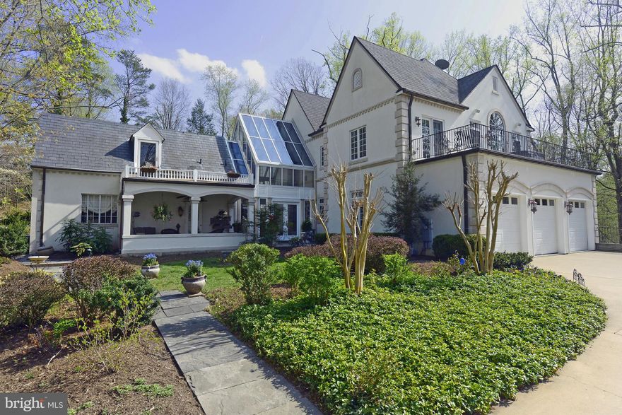 Perched atop 3.5 private and gated acres, this residence is a harmonious combination of old and new! It features a wonderful layout with  a fantastic gourmet kitchen that's open to the family room, luxurious master suite, and a walkout lower level. The spectacular grounds offer a pool with slide, hot tub, waterfall, pool house, artist studio/green house and caretaker's house.