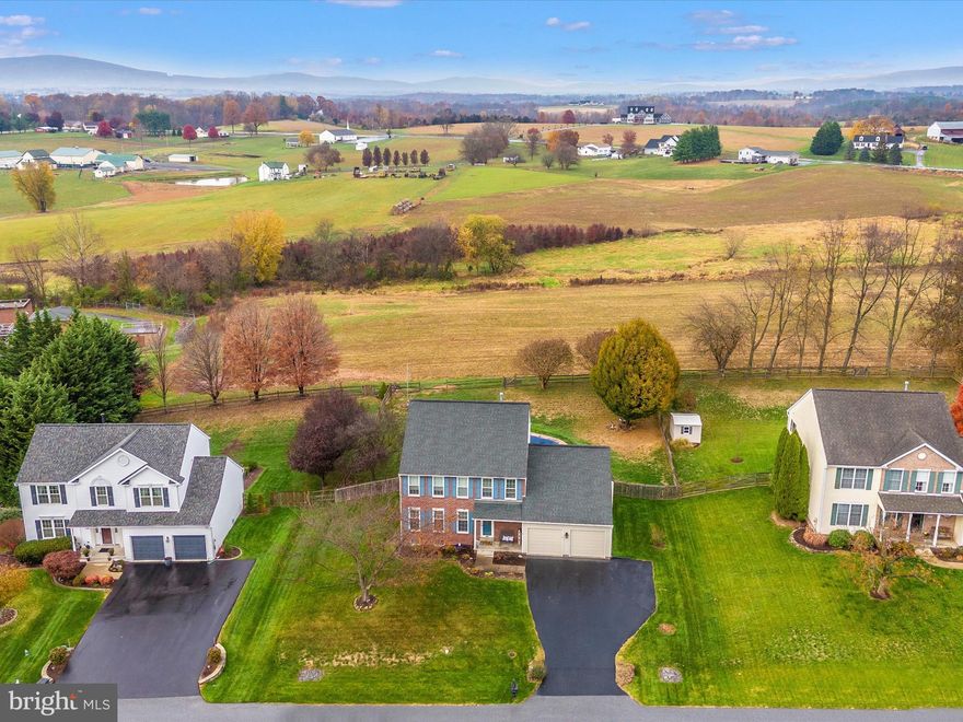 Exceptionally well maintained and beautifully updated with nice sized rooms that flow easily together. The list of updates includes all of the major systems - Roof, HVAC, Windows, Floors, Pool Liner and some fresh paint too.  Backing to farmland, this home offers stunning views from the window above the kitchen sink and all of the other windows on the back of the house as well. Three finished levels provides the perfect space for everyone and includes a primary bedroom with a private on-suite and walk-in closet! The sellers smartly added a 4 foot extension on the family room when the house was being built so bring your biggest, comfiest couch, it will fit!  However, with the beautiful views, you may choose to spend more time outside where the living space extends to the backyard with a large patio/pool surround, inground pool and fully fenced yard. Enjoy the serenity of living in the country and the ease of a 10 minute drive  to downtown Frederick and major commuter routes.