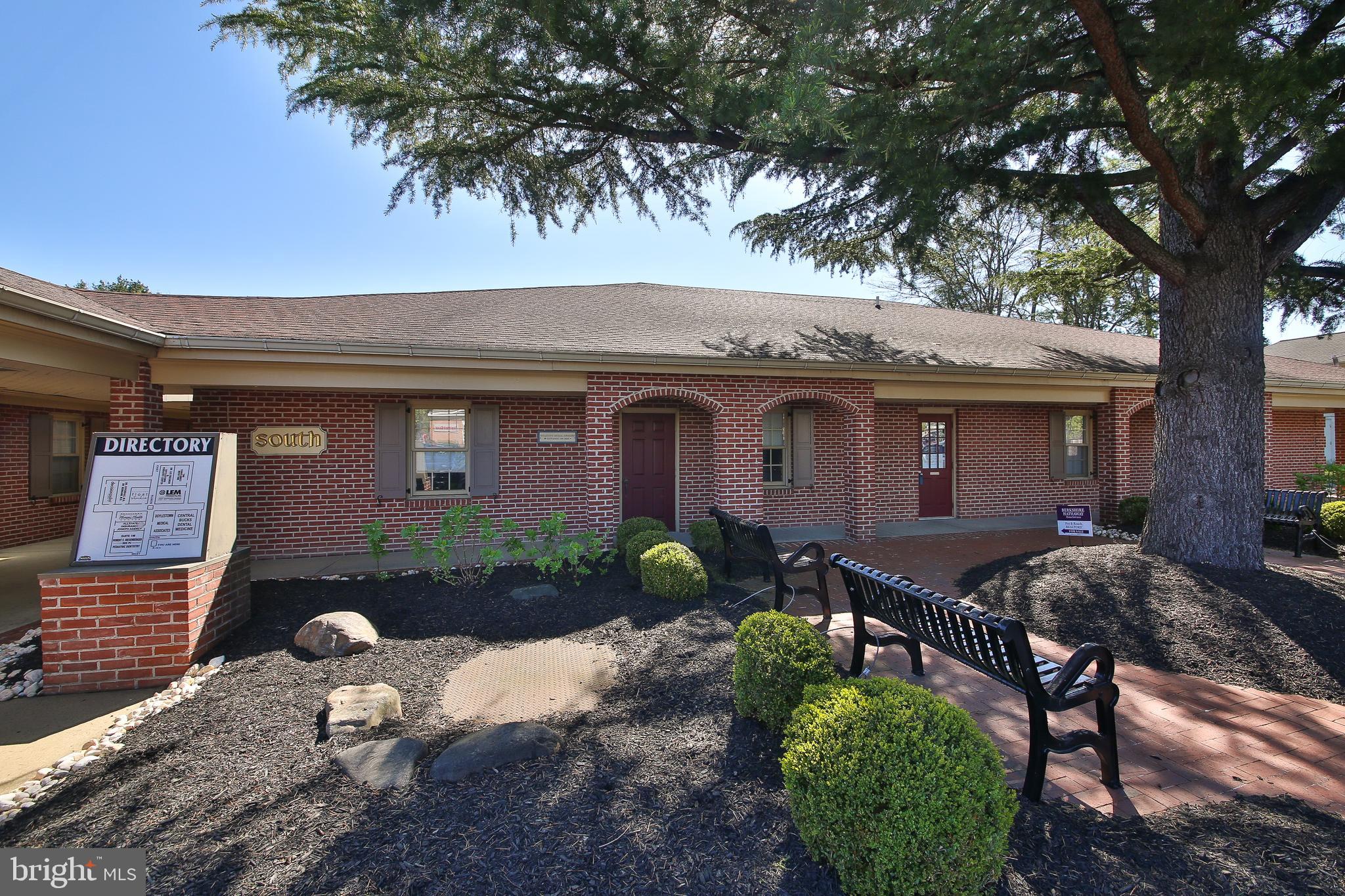 If you are in need of medical or professional office space this is the perfect choice. Situated in a high profile Doylestown Borough setting, this attractive, brick Atrium office complex was the longtime occupancy of a well-respected Doylestown Internal Medicine group. Their office consists of two units 2 South and 3 South comprising a total of 2350' sq ft with an additional 1600' sq ft basement that is partially finished. Completely turn-key, there will be likely no need to make any changes other than adding your choice of decorator paint color or carpet. The lobby area has a double closet and single closet, a bathroom and (16) recessed lights with an outside exit to interior courtyard. The reception area has laminate flooring, (3) built-in desks, storage closet and (9) recessed lights. The front of the unit offers (2) exam rooms with overhead lighting, laminate floors and vanity sinks, one room with a wall countertop. The center of the unit provides an office space with laminate flooring and (6) recessed lights, hallway wall countertop, workroom with laminate flooring, overhead lighting and storage cabinets with sink. In addition, there is a 2nd bath. The rear of the unit has a storage closet, the 3rd bath, kitchen with laminate flooring, sink, tiled backsplash, built-in seating, front door outdoor access. (6) more exam rooms are found in this area with laminate flooring, overhead/recessed lighting and vanity sinks with another outdoor exit to courtyard. Throughout the office space you will find tasteful crown molding and chair rail trim with window treatments and blinds that will stay. The basement provides additional square footage, if needed, with a finished area that can serve the staff needs. Best of all, since this office consists of 2 units you can revert back to separate spaces to lease for additional income.