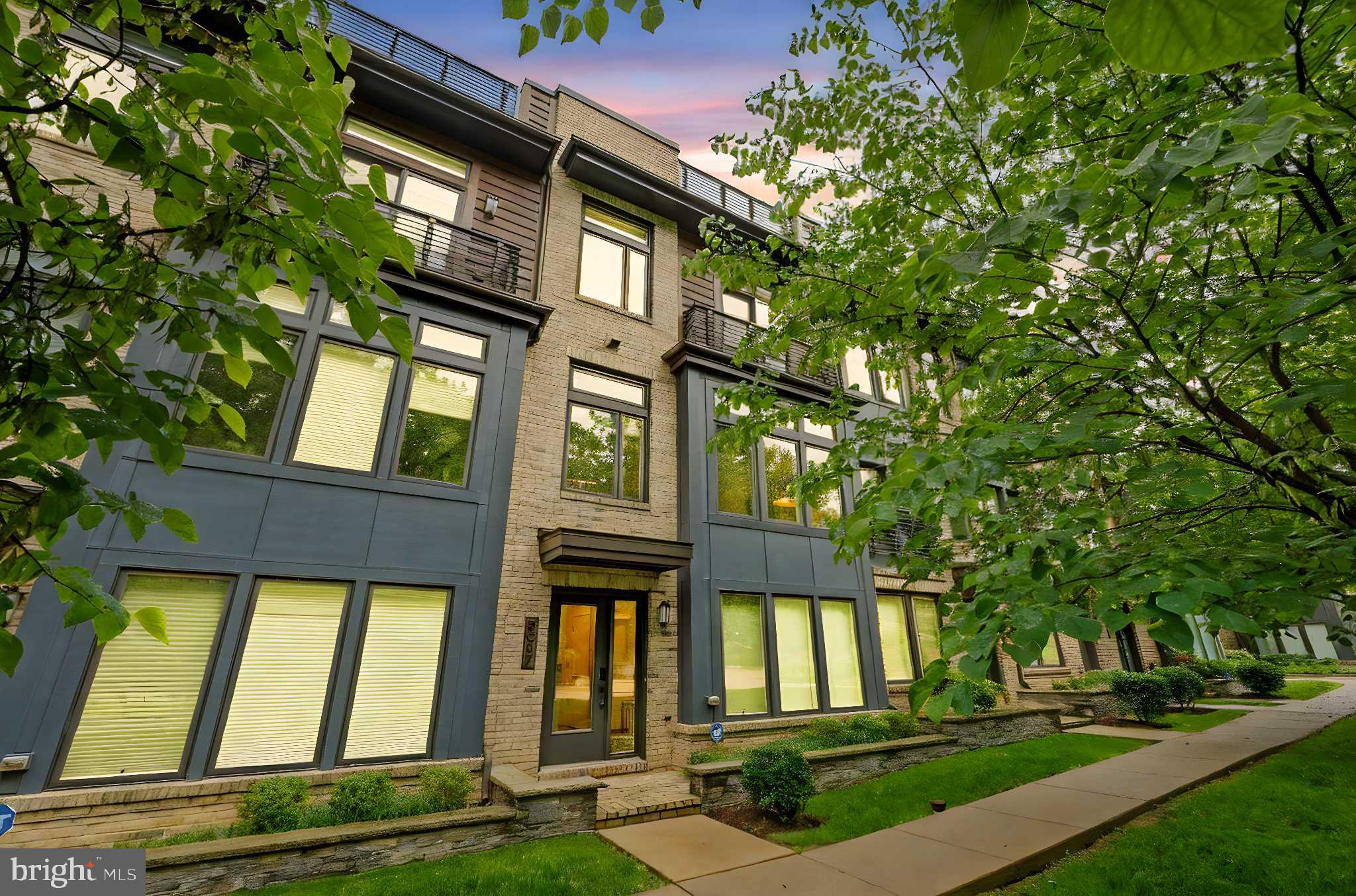 Discover the rare opportunity to lease a like new 4-level townhome with a private elevator in the prestigious Grosvenor Heights community of Bethesda. Designed for luxurious living and effortless entertaining, this stunning residence features floor-to-ceiling windows, rich hardwood floors, a gourmet kitchen with premium appliances and a large center island, and an open-concept layout with a sleek custom bar. The primary suite boasts dual walk-in closets and a spa-inspired bath, complemented by three additional bedrooms and two elegant full baths. Enjoy a spectacular rooftop deck complete with a built-in kitchen and gas grill, perfect for outdoor gatherings. Additional highlights include an oversized two-car garage, curated designer furnishings, built-in Sonos speakers, and Hunter Douglas remote-controlled shades. . Fully move-in ready, this exceptional home offers a turn-key rental experience in one of Bethesda’s most sought-after communities. Minutes from the metro and Wildwood Shopping Center. Possibility to rent furnished with high end furniture.