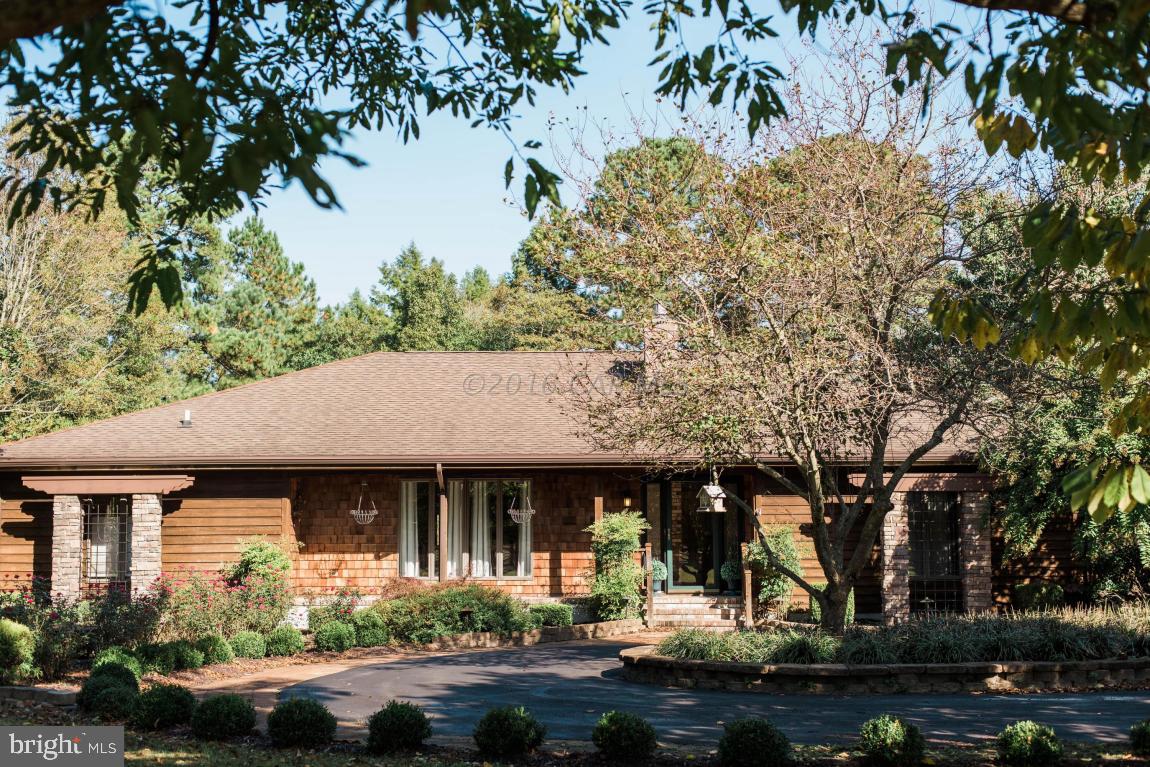 Beautifully landscaped/irrigated 6.30 ac on a creek that leads to Wicomico River! Swimming pool with large decking from house and around pool! Door to bath off pool deck. T&G cedar valted ceiling in great rm. Great open concept for entertaining. Kitchen remodeled with custom solid wood cabinets w/built in pantry and granite tops. Thermadore cooktop, other appliances Kitchen Aide stainless steel. Central Vac. Hardwood and tile in most areas. Custom California Closet! Seller will leave pool table, Viking stainless steel grill and gun safe! Fireplace w/gas logs and sep pellet stove! Brick pizza oven outside! Separate building/man cave along with 2 storage buildings. Aerial Drone video at Vernon Esham Builders website Esham Real Estate page.
