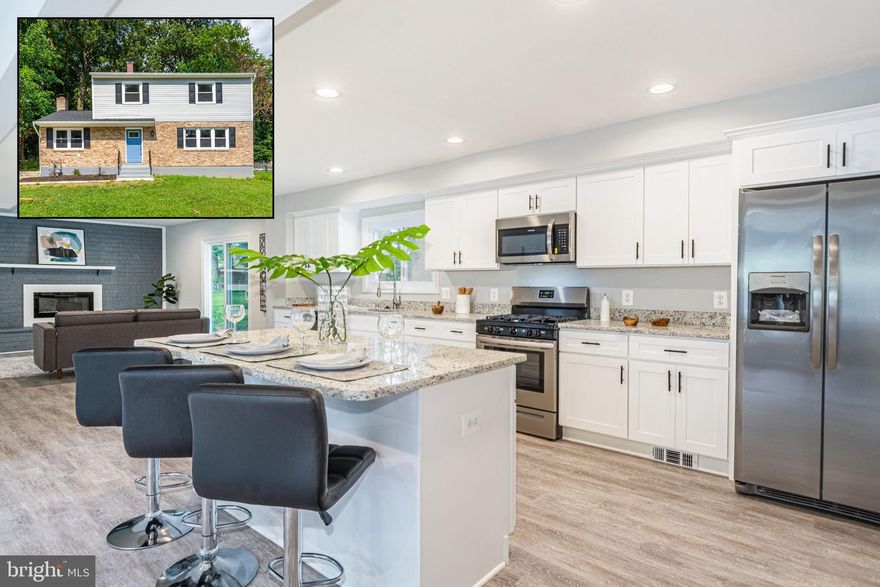 HIGH END RENOVATION! Enter into a sun-filled living area with beautiful new flooring that seamlessly flows throughout the entire first floor.  Enjoy a chef's dream kitchen with custom white shaker cabinetry, stainless steel appliances and granite countertops.  The entire first floor is completely open concept and great for entertaining and also features a conveniently located half bathroom.  Upstairs you will find three spacious bedrooms, a renovated full bathroom, and a fourth bedroom that is your master suite with en-suite bathroom.  Outside you can relax on your rear deck overlooking your huge flat backyard.  Enjoy maintenance free living as this home features new windows, new roof, new siding, new HVAC, updated electric, all new paint and flooring.... the list goes on and on!  House is vacant and easy to show so schedule your showing today!