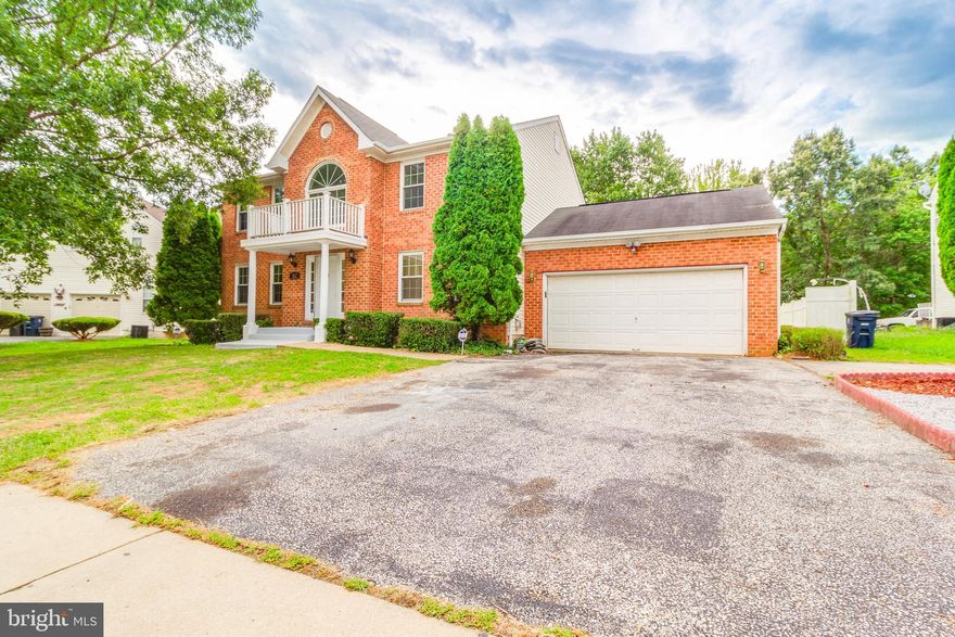 IMPRESSIVE!! This 4BR, 3.5BA, 2 car garage colonial will leave you speechless.  As you enter this beautiful front brick house you will become mesmerized with the glossy ceramic tiles that shine from the foyer all the way to the kitchen. The spacious recently remodeled kitchen is flooded with natural light entering from the huge bay window!  Morning coffee will be enjoyable at the table space overlooking the beautiful leveled yard.  The kitchen boasts plenty of cabinet space, white cabinetry, high-end stainless steel appliances which include two wall ovens, double bowl apron sink, trendy backsplash, kitchen island with cooktop, cooker hood chimney, granite countertops, pantry, recessed lighting and access to the 2 car garage.  Off the kitchen the elegant pendant lights creates a sophisticated open division to the family room.  You will love the gleaming hardwood floors in the family room. Sitting by the fireplace will become your favorite place to be during winter nights, the details of it's feature wall helps create a warm and relaxing environment. State of the art Pillars are used as ornaments to create a soft division between the family and living room. The formal dining room also has beautiful hardwood floors and plenty of natural light.  Gazing to the upper level you will notice the spacious master bedroom with a huge walk-in closet and master bathroom with shower, double sink and tub.  The second bedroom features a decorative arched window and a balconet that adds life to this room.The hallway bathroom in the 2nd level has also been recently beautifully updated with a double sink, ceramic tiles and bathtub ceramic wall decor that gives it a modern look!  Big family? No problem, there are two additional good size bedrooms that are very bright and have been recently painted.  Let's talk about the lower level!! Open recreation area with brand new ceramic tiles, and plumbing ready for you to build your ideal wet bar!! Also in the lower level modern full bathroom with ceramic tiles, and a big stand-up shower with glass doors.  From the lower level you can also walk-out to the spacious fenced yard!!!   Don't miss out on this beauty, too many details to list!! Hurry and come see it today!!OFFERS DEADLINE SUNDAY 08/02 @6pm