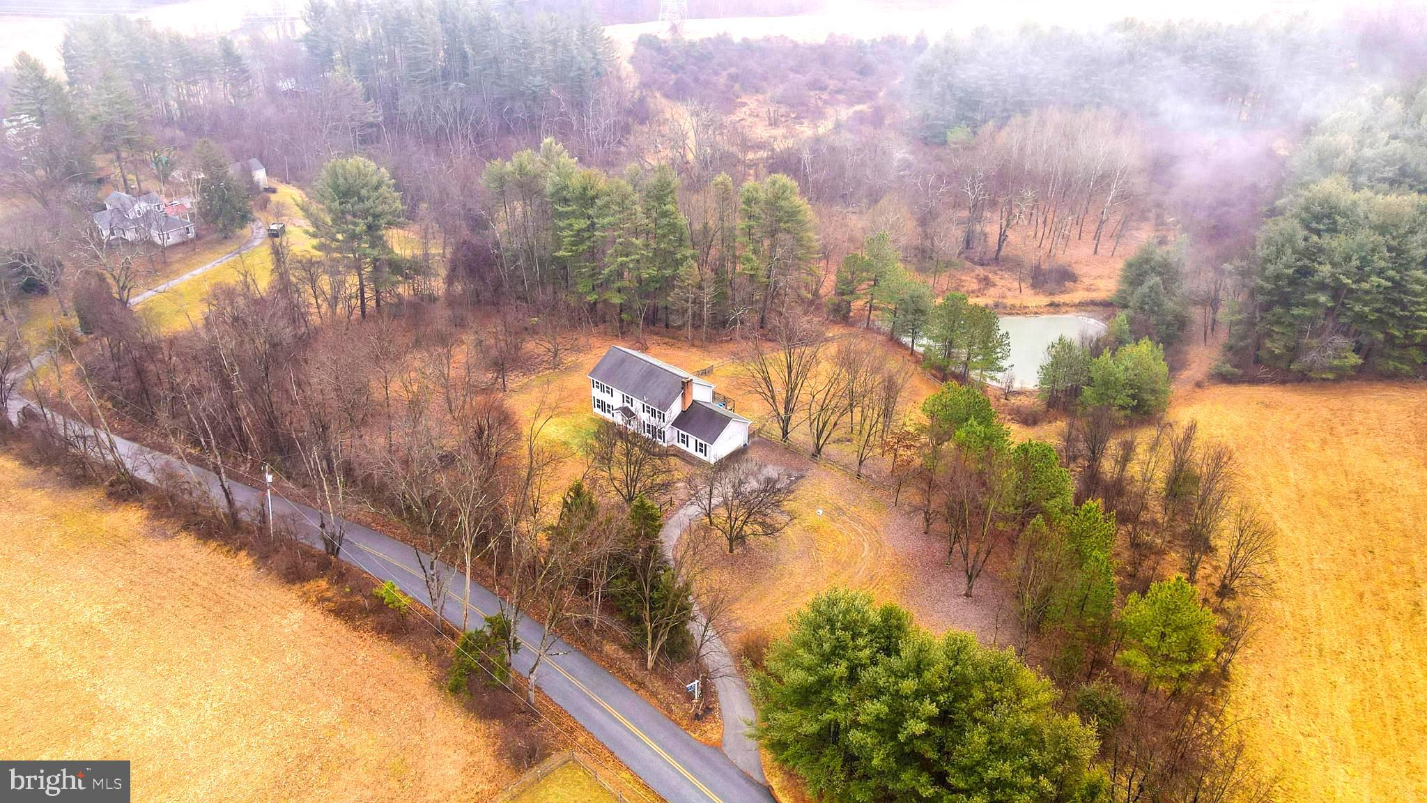 Welcome!!! If you are looking for peace and quiet then you have come to the right place. This 4 bed, 2.5 bath home sits on 10 acres with beautiful views of nature all around, and not to mention your very own pond. This home has many recent upgrades from the kitchen, to barn doors, windows, siding, recessed lighting, appliances, and many more.