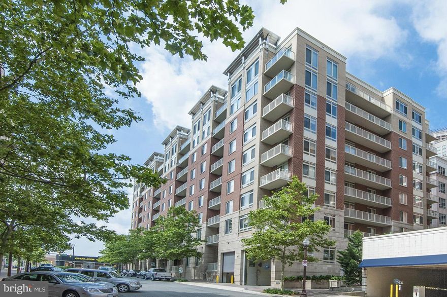 New Price on this Luxury Condo! Park your car and walk to everything: 2 Metros, Taylor Gourmet, Rusticos, Starbucks, Gold's Gym & more.  Sparkling 2 bedroom/2 bathroom PLUS den with reserved garage parking space! Living Room with custom hardwood floors & high ceilings! Kitchen with granite counters & stainless steel appliances. Master suite, walk in closet & spa-like bathroom.