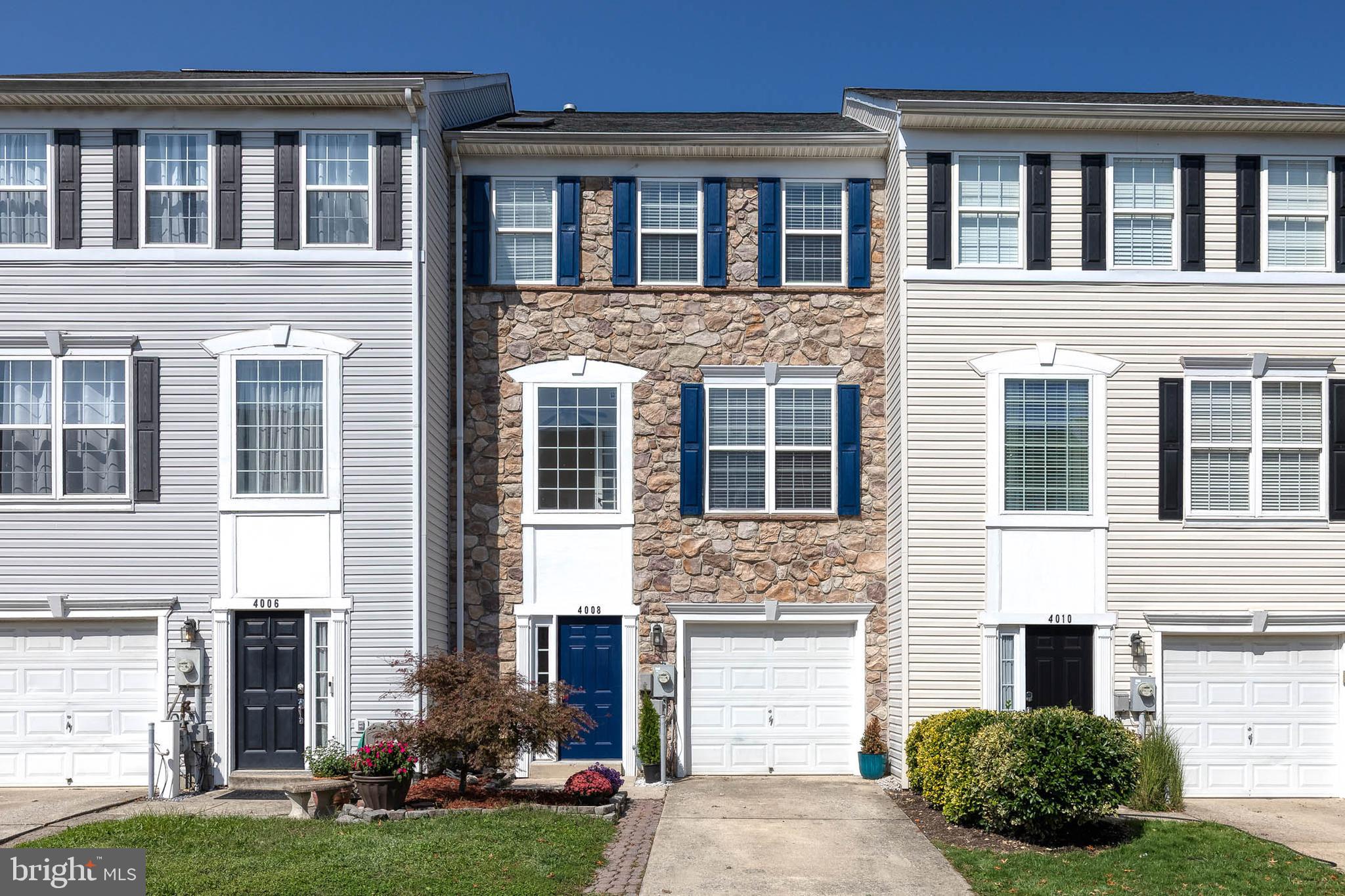 Gorgeous Stone-Front Garage Townhome. Move right into this beautifully maintained stone-front townhome located in the sought-after Applegate North community. Featuring luxury vinyl flooring, brand new carpeting, and fresh paint throughout, this home is truly move-in ready. Step into the welcoming foyer and discover an incredibly versatile lower level that includes a spacious flex room—ideal as a family room, bedroom suite, home office, or media room, already wired for a projector and speakers. This level also features a full bathroom, large walk-in closet, laundry room, and walk-out access to a charming stone patio—perfect for outdoor gatherings or peaceful mornings. The open-concept main level is designed for both entertaining and comfortable everyday living. Enjoy a bright living/dining area with a convenient pass-through to the well-equipped kitchen, boasting granite countertops, stainless steel appliances, a pantry, and ample cabinet space. Just off the kitchen, you'll find a cozy breakfast area and adjoining family room with sliders that lead to a spacious Trex deck with elegant black railings—perfect for relaxing or hosting friends and family. A bonus den/office with French doors offers a private space for work or unwinding. Upstairs, retreat to the luxurious primary suite featuring vaulted ceilings, a large walk-in closet, and a sun-drenched en-suite bath with a soaking tub, double vanity, and walk-in shower. Two additional generously sized bedrooms offer ample closet space and share an updated full hallway bath. Enjoy scenic walks through the community and fun afternoons at the neighborhood playground. Ideally located near schools, shopping, restaurants, major highways, Ft. Meade, DC, Annapolis, Baltimore, and a wide range of water-oriented activities. Complete with smart home thermostat. Don’t miss the opportunity to own this stunning townhome that offers space, style, and convenience!