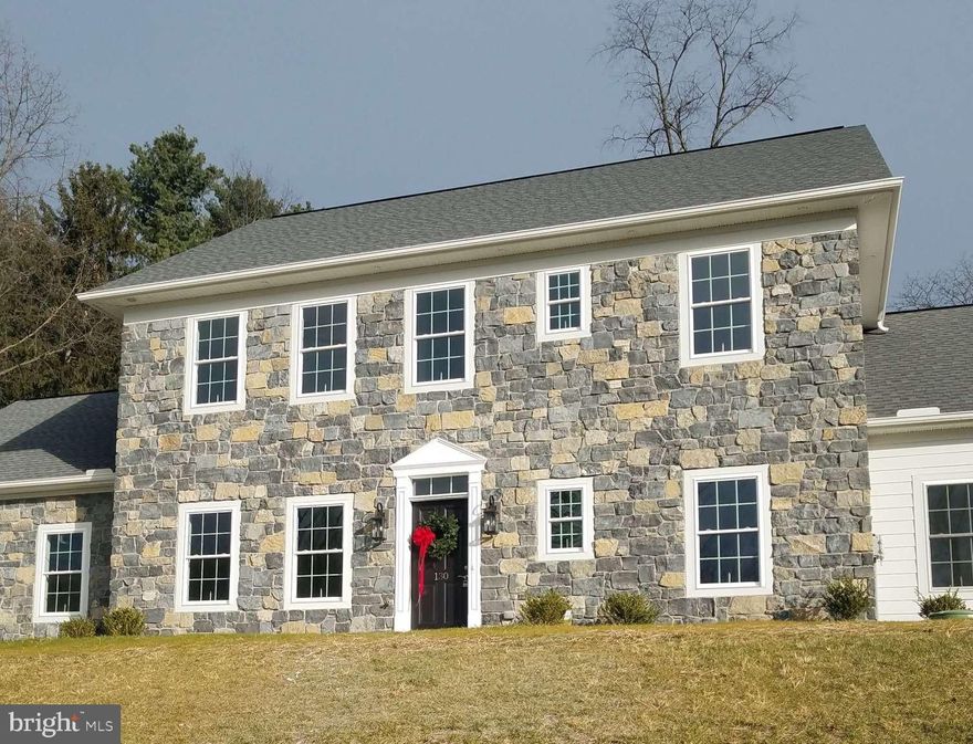 NEW CONSTRUCTION COMPLETED DECEMBER 2025. This new home features Historic Colonial Architecture with a modern design and is located in the Woodbriar Estates Chambersburg, PA. Just minutes from shopping, dining, schools, I-81, Penn National Golf Course and hiking in Caledonia State Park. This home has 4 bedrooms, 4 bathrooms, 1st floor flex room and 2nd floor bonus area. Relax in the open great room that includes kitchen with granite counter tops, dining area and living room with vaulted ceiling and lots of windows for natural light. The primary bedroom and bathroom with walk-in closet is located on the first floor. Laundry hookups with cabinets including a linen cabinet on 1st floor. There is also laundry hookups with closet on 2nd floor. Fireplace, wide vinyl plank flooring, storage under stairs, breakfast bar, 9’ ceiling height on 1st floor, recessed lighting, ceiling fans in all bedrooms, Double pane tilt Pella Brand windows and many other upgrades. The exterior is a natural stone with white siding. A grand two story foyer with open stained oak staircase will great visitors inside the front door. Schedule your showing today!!