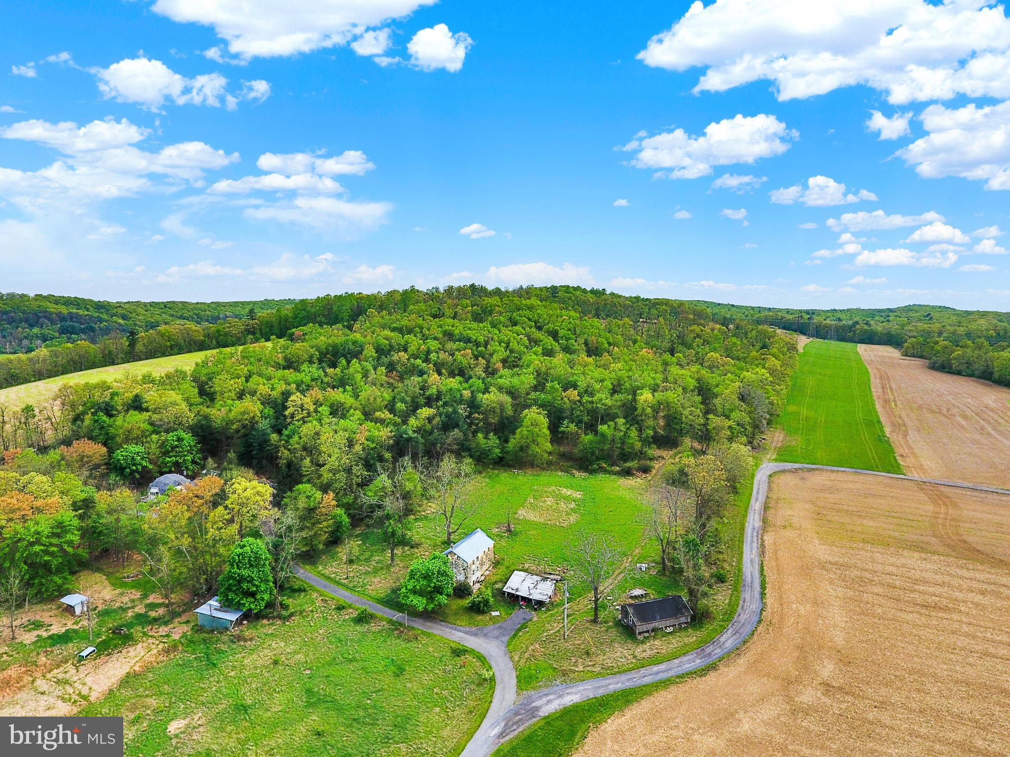 COMMERCIAL SUBDIVISION AVAILABLE WITH ROAD FRONTAGE. Almost 50 acres of sweetness. Convenient location, many possibilities. Keep property as-is or take a look at the potential for development.
Cool old stone home in need of major renovations. Call list agent for all details and plans.