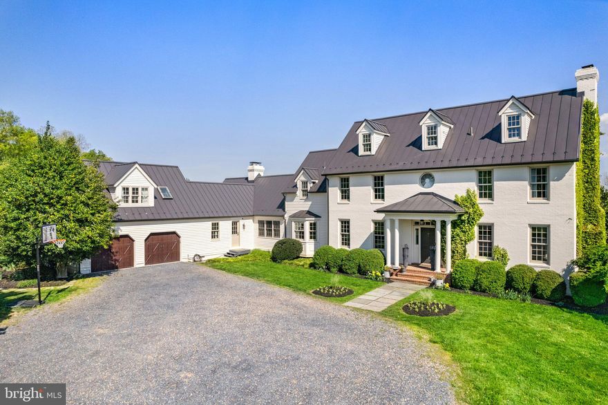 Spectacular sunsets, glorious night skies and Blue Ridge Mountain views! Conveniently located between Middleburg and Purcellville, this property's open and level 10.7+/- acres enjoy Blue Ridge Mountain views to the west and pastoral and sunrise views to the east.
Originally custom built in 1989, this classic home features brick and wood siding and a standing seam roof with many upgrades over the years. More recently they include a Tesla wall charging unit in the garage, a spacious invisible fence for pets, newly insulated crawl space and recently replaced heat pumps. The home enjoys stable Wi-fi with All Points Broadband through a direct sight line to Mount Weather; and Fiber internet is planned with Dominion Power. In the early 2000’s, the home underwent significant renovation and recently, thoughtful use of color and space beautifully blends more traditional spaces with contemporary ones.

Bathed in natural light, the foyer faces the open staircase to both the upper and lower levels. To the right opens into the dining room with wood-burning fireplace, and to the left a sitting room; these rooms enjoy 9' coffered ceilings. The walls, ceiling and trim are all painted a soft white with lightly stained wood floors. Open windows create a very inviting, light, and airy living space. From the living room, one enters the stunning kitchen, which is open to the double family room, a true center of the home where family and friends gather. The kitchen features white cabinetry, wonderful counter space with part marble and part leathered granite countertops, a Subzero with ice maker, dishwasher, and a large island with a 6-burner gas range and breakfast bar. The family room features a 20’ vaulted ceiling, exposed stained beams, and a free-standing, double fireplace which grounds the room. 
To the left of the family room is a hallway which leads to a full bath, mud room with laundry, two car garage and stairwell to an upper-level bedroom suite or studio with full bath. This above garage bedroom features a vaulted ceiling and a newly installed heating-cooling unit.
This floor plan offers wonderful flexibility of rooms with multiple living and bedroom areas. The primary and two additional bedrooms are on the second level above the living and dining rooms. The primary bedroom enjoys vaulted ceilings and natural light and features a private lofted office, large walk-in closet, luxurious bath with separate shower and soaking tub, double vanity, and private water closet room. The lower level features a potential guest room, full bath, den with cabinets and a sink, and the furnace room.

Family room French doors lead out to the back deck, partially covered with a pergola draped in wisteria vines, and the backyard enjoys pastoral views with a large fire pit. Sunrises ascend over the back barn and breathtaking sunsets color the mountain range for extraordinary memories. The vast night sky is wonderful for sky gazers with little light pollution. Magnolia trees were thoughtfully transplanted with the start of a small apple orchard—all part of a landscaping architectural plan that can be shared with new owners. 

A gravel drive leads to the front of the home and provides ample parking for guests. MyQ garage openers and Blink security cameras are installed. A second drive leads to the center aisle 4 stall barn. The barn opens into 2 paddocks with potential ride-out. Three board fencing surrounds the entire property and defines the 2 fenced paddocks, with an invisible dog fence surrounding the central home property. This property is being sold "as is”, inspections will be allowed but no repairs will be made.

Enjoy the serenity of the countryside with unparalleled views, equally convenient to the nearby towns of Middleburg and Purcellville with easy access to both major east/west roadways to—Rt. 50 and Route 7—as well as Dulles International Airport.