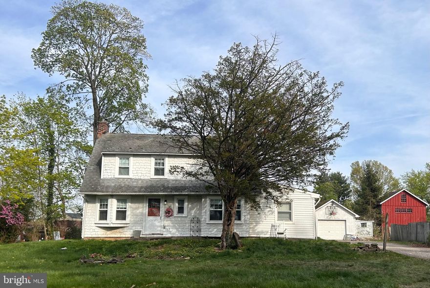 Welcome to the Historic Village of Penns Park of Bucks Co.  This unique Dutch Colonial was expanded by previous owners to provide plenty of living space while maintaining its unique charm. It was built in 1919 and is nestled back beyond the expansive front lawn giving it privacy from the road. The property sits on over .8 acre lot (see exact in Co. records) facing the West in the front and East in the rear with beautiful views as the sunrises and sets, with front and rear patios. This cozy village home has many original features of various built ins, 5 panel doors (most with original hardware), window seats with storage, original cast iron radiators, and more. The living room features a unique v-shaped window with beautiful wooden sill, wood burning insert, closet, and turn step staircase with landing and original wood banister.  The dining room offers plenty of space for a full dining set, built-in window seat & storage drawers, a spacious closet with shelving opposite a built-in glass door display closet.  The kitchen & powder room are newly renovated with shaker style cabinets, quartz countertops, original vanity, bead board and copper finishes respectively.  Adjacent to the kitchen is a cheery breakfast room with 3 windows featuring Roman shades.  Just off of the breakfast room step down into another spacious room with hardwood flooring & plenty of windows. With copious natural light throughout the day, uses can vary from a study, office, to a fitness room and more.

On the second floor there are 3 bedrooms all with generous closet space and wood floors. The master bedroom is very spacious with 2 closets and built in bookshelves. The second bedroom is almost as large as the master with 2 spacious closets. The 3rd room offers another large closet with shelving.  In addition, a bonus room on second floor features a large picture window and a built-in window seat with shelving underneath.  The view from the large picture window is lovely at any time of day. With full sun from morning thru mid-afternoon, it's a great space for an art or craft studio, plants, and more.  The bathroom is newly remodeled, in a style that gives a nod to the original charm of the home with its own built in linen closet. The front of the house faces the West, and the rear faces the East providing spectacular views of sunrise and sunset and excellent cross breezes on lots of spring and fall days.

Just off of the kitchen is the entrance to basement and the mud room of approx. 55 sq.ft. conveniently appointed with the washer/dryer.  At the back or rear entrance there is a spacious cement patio that leads to the lush greenery of the yard.  The 2-car garage has an attached old side shed, 2nd floor storage & its own electric panel.  To the left of the driveway there are 2 cement parking spots next to the back cement patio.  The driveway can accommodate additional parking of 4 to 6+ spaces, convenient when entertaining.

This Charming uniquely situated Village home offers highly desired Bucks Co traditional home living.  The Village is situated just around the corner & down the street from the Grange Fair Grounds (which hosts the Wrightstown Farm Market), Quaint Commercial shopping area, a local Organic CSA and more.  It's within a short ride to iconic Bucks Co. destinations like River Road/ Canal (biking, fishing & more), New Hope, Peddlers Village, Newtown, Doylestown & more!